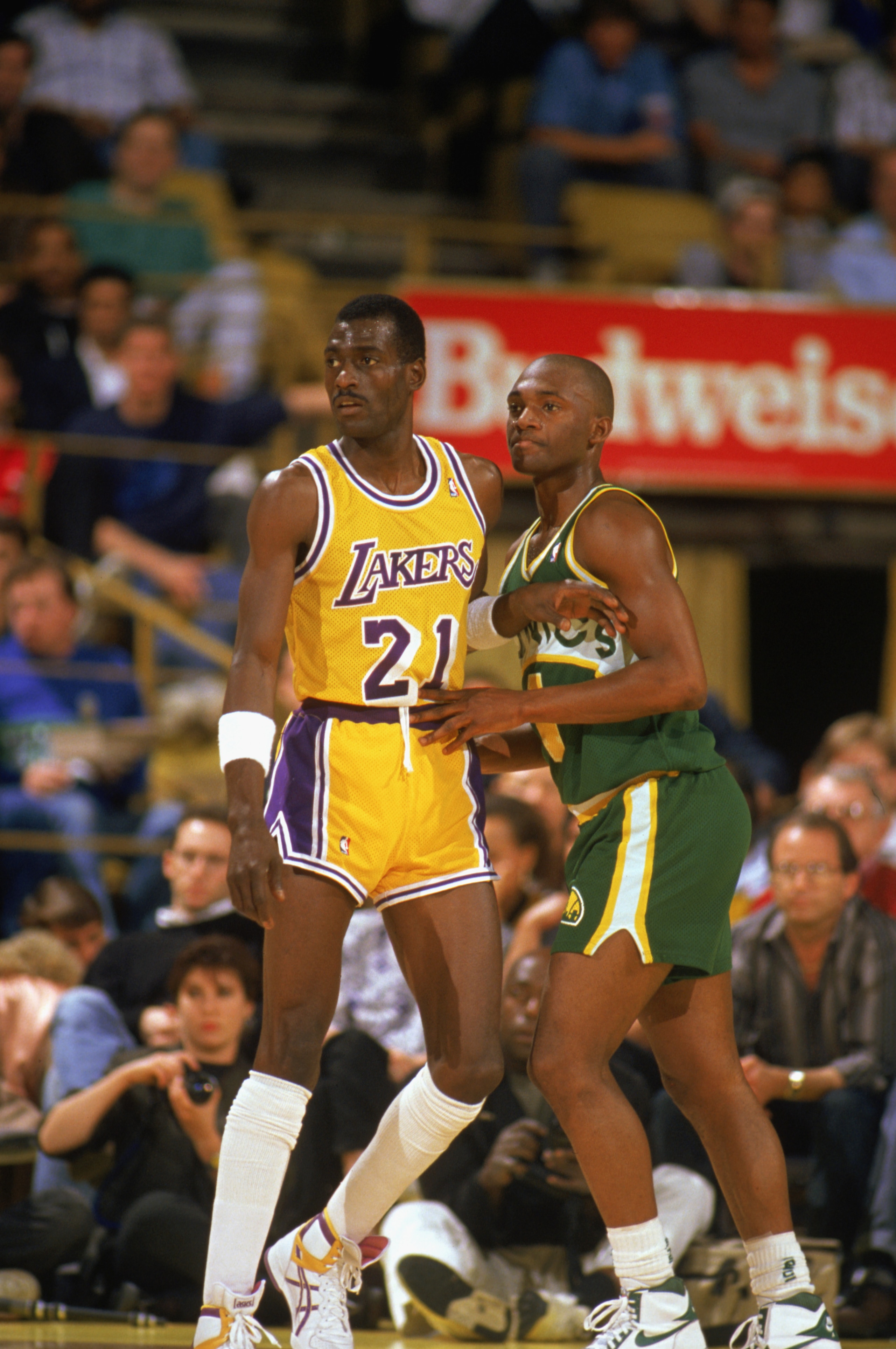 LOS ANGELES - 1990: Sedale Threatt #4 of the Seattle Supersonics and Michael Cooper #21 of the Los Angeles Lakers battle for position during a game in the 1989-1990 NBA season at the Great Western Forum in Los Angeles, California. (Photo by Ken Levine/G LOS ANGELES - 1990: Sedale Threatt #4 of the Seattle Supersonics and Michael Cooper #21 of the Los Angeles Lakers battle for position during a game in the 1989-1990 NBA season at the Great Western Forum in Los Angeles, California. (Photo by Ken Levine/G