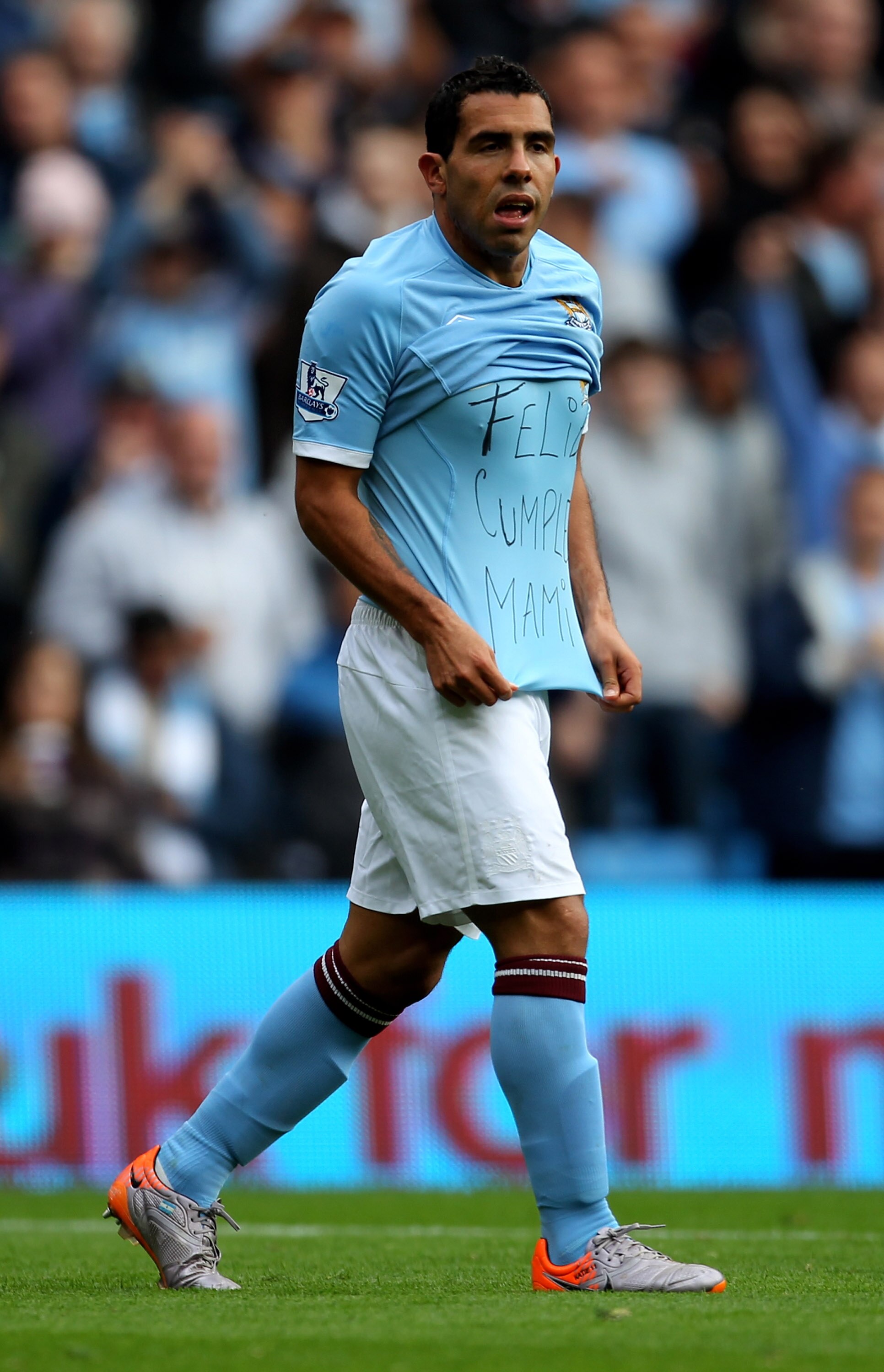 MANCHESTER, ENGLAND - SEPTEMBER 25:  Carlos Tevez of Manchester City shows off a message on his T-Shirt after scoring the opening goal during the Barclays Premier League match between Manchester City and Chelsea at the City of Manchester Stadium on Septem