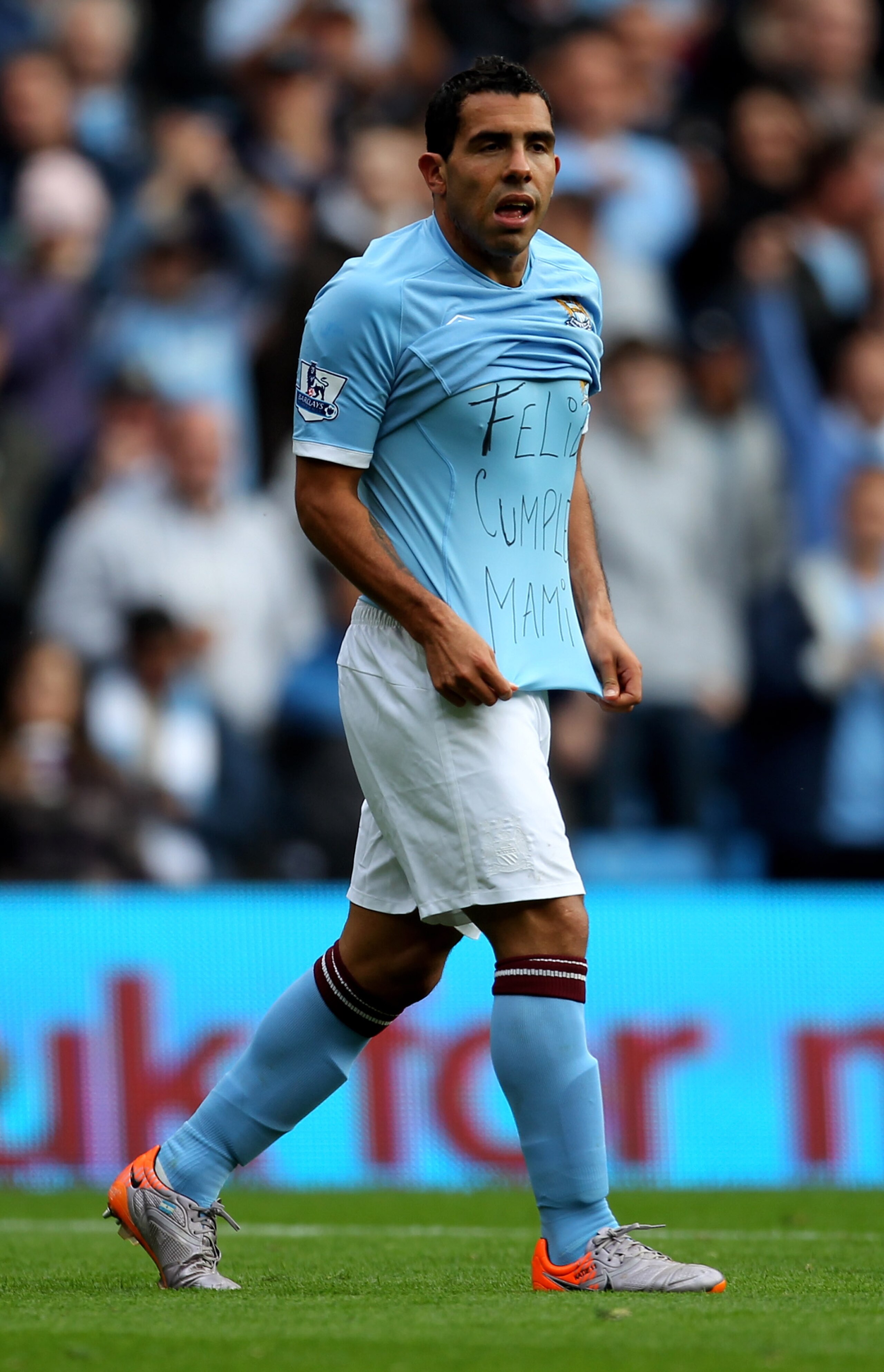 MANCHESTER, ENGLAND - SEPTEMBER 25:  Carlos Tevez of Manchester City shows off a message on his T-Shirt after scoring the opening goal during the Barclays Premier League match between Manchester City and Chelsea at the City of Manchester Stadium on Septem