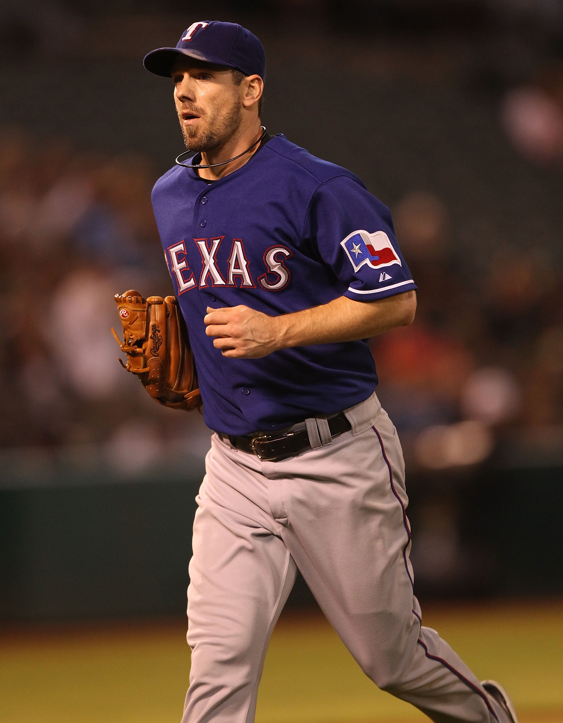 OAKLAND, CA - SEPTEMBER 23:  Cliff Lee #33 of the Texas Rangers runs off the field against the Oakland Athletics during a Major League Baseball game at the Oakland-Alameda County Coliseum on September 23, 2010 in Oakland, California.  (Photo by Jed Jacobs
