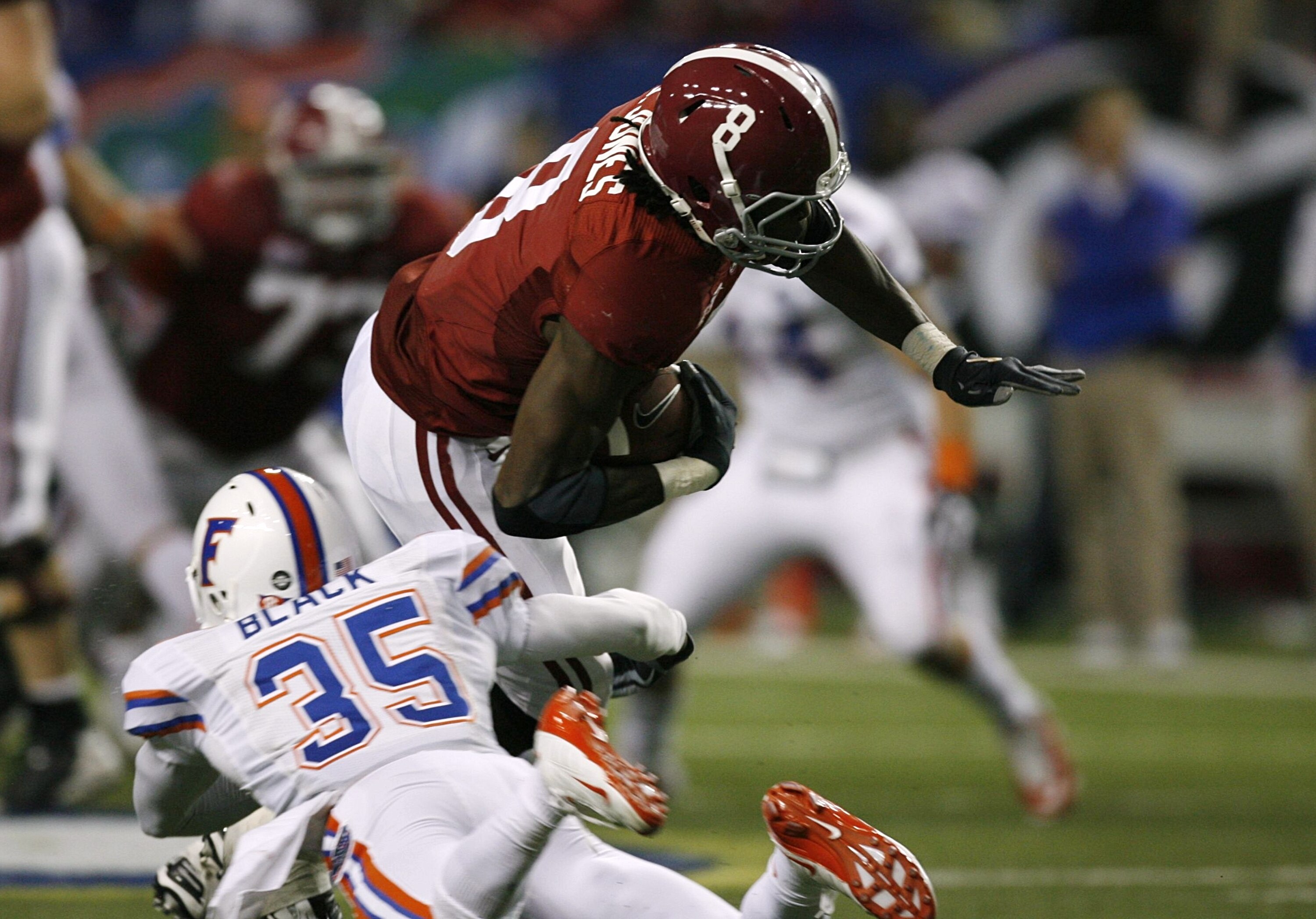 ATLANTA - DECEMBER 5:  Julio Jones #8 of the Alabama Crimson Tide runs for yards after the catch against Ahmad Black #35 of the Florida Gators during the SEC Championship game at Georgia Dome on December 5, 2009 in Atlanta, Georgia.  (Photo by Kevin C. Co