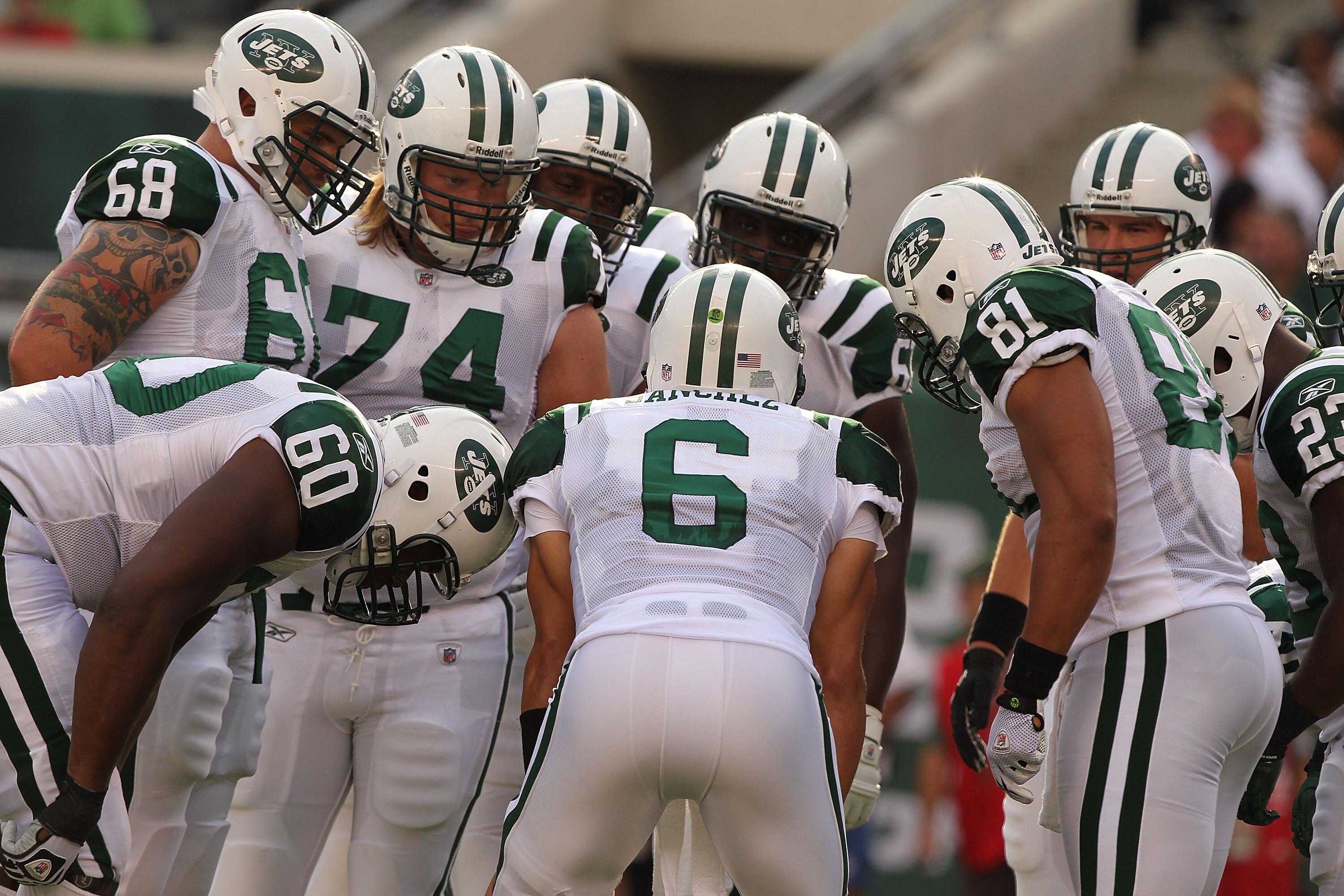 EAST RUTHERFORD, NJ - SEPTEMBER 19: Mark Sanchez #6 of the New York Jets calls the huddle against the New England Patriots during their game on September 19, 2010 at the New Meadowlands Stadium in East Rutherford, New Jersey. (Photo by Al Bello/Getty EAST RUTHERFORD, NJ - SEPTEMBER 19: Mark Sanchez #6 of the New York Jets calls the huddle against the New England Patriots during their game on September 19, 2010 at the New Meadowlands Stadium in East Rutherford, New Jersey. (Photo by Al Bello/Getty