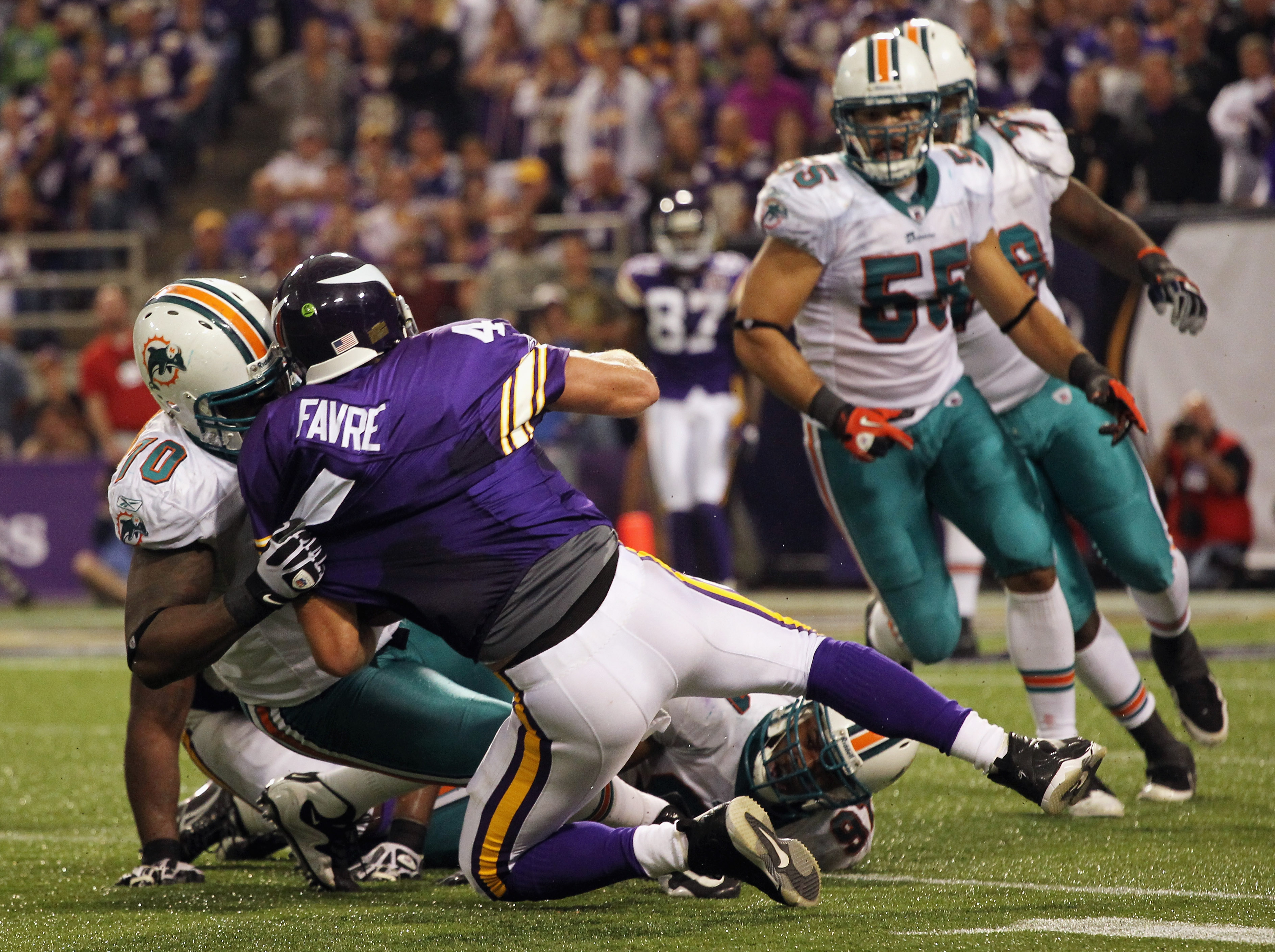 MINNEAPOLIS - SEPTEMBER 19:  Quarterback Brett Favre #4 of the Minnesota Vikings is sacked by Kendall Langford #70 of the Miami Dolphins during the second half of the game on September 19, 2010 at Hubert H. Humphrey Metrodome in Minneapolis, Minnesota.  (