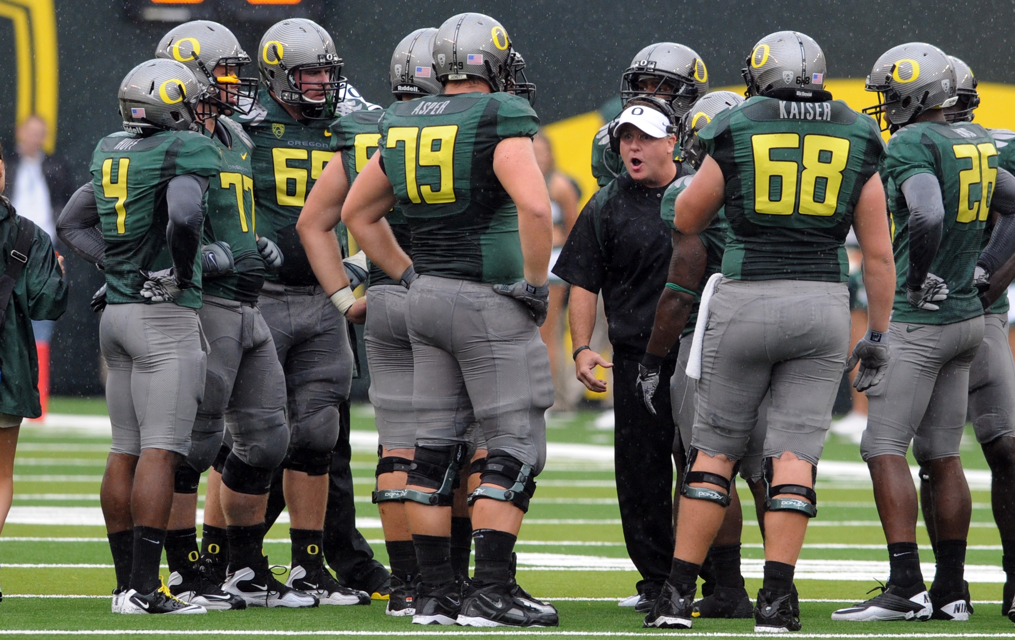EUGENE, OR - SEPTEMBER 18: Head coach Chip Kelly of the Oregon Ducks has some words with his offensive unit during a time out in the second quarter of the game against the Portland State Vikings at Autzen Stadium on September 18, 2010 in Eugene, Oregon.