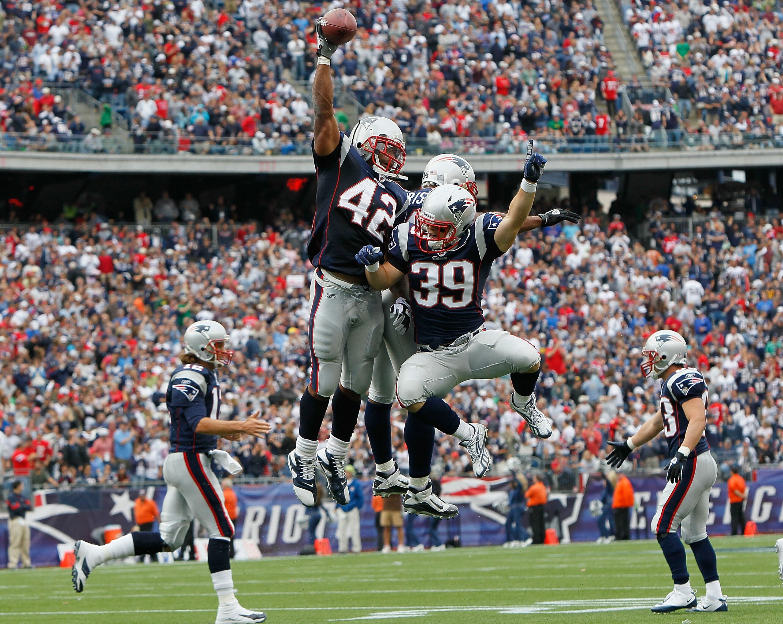 FOXBORO, MA - SEPTEMBER 26: BenJarvus Green-Elllis #42 of the New England Patriots celebrates his touchdown with teammates Sammy Morris #34 and Danny Woodhead #39 in the second half against the Buffalo Bills at Gillette Stadium in the second half on Septe
