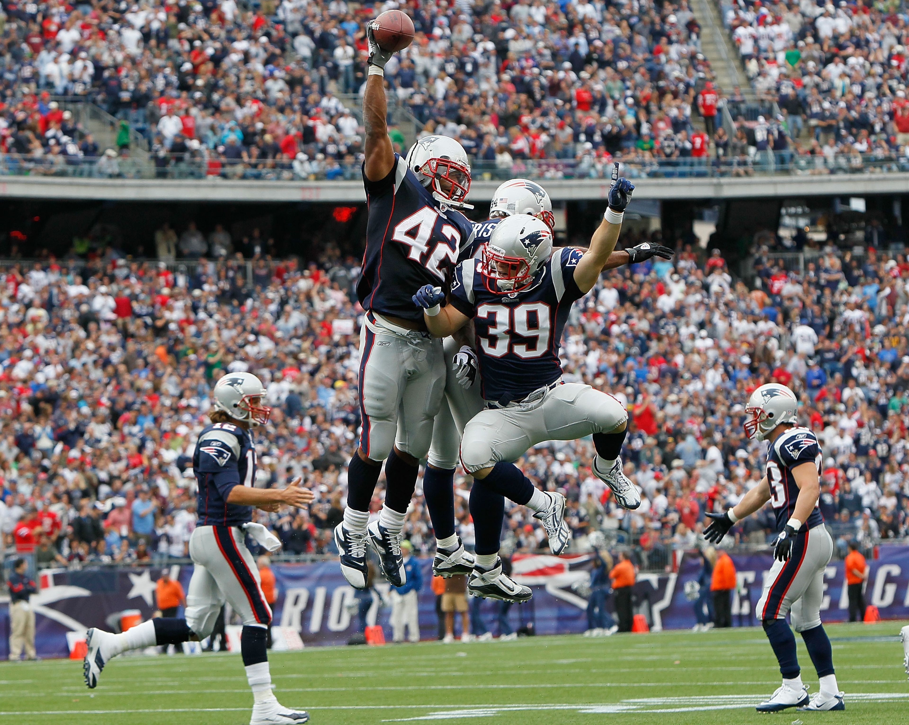 FOXBORO, MA - SEPTEMBER 26: BenJarvus Green-Elllis #42 of the New England Patriots celebrates his touchdown with teammates Sammy Morris #34 and Danny Woodhead #39 in the second half against the Buffalo Bills at Gillette Stadium in the second half on Septe
