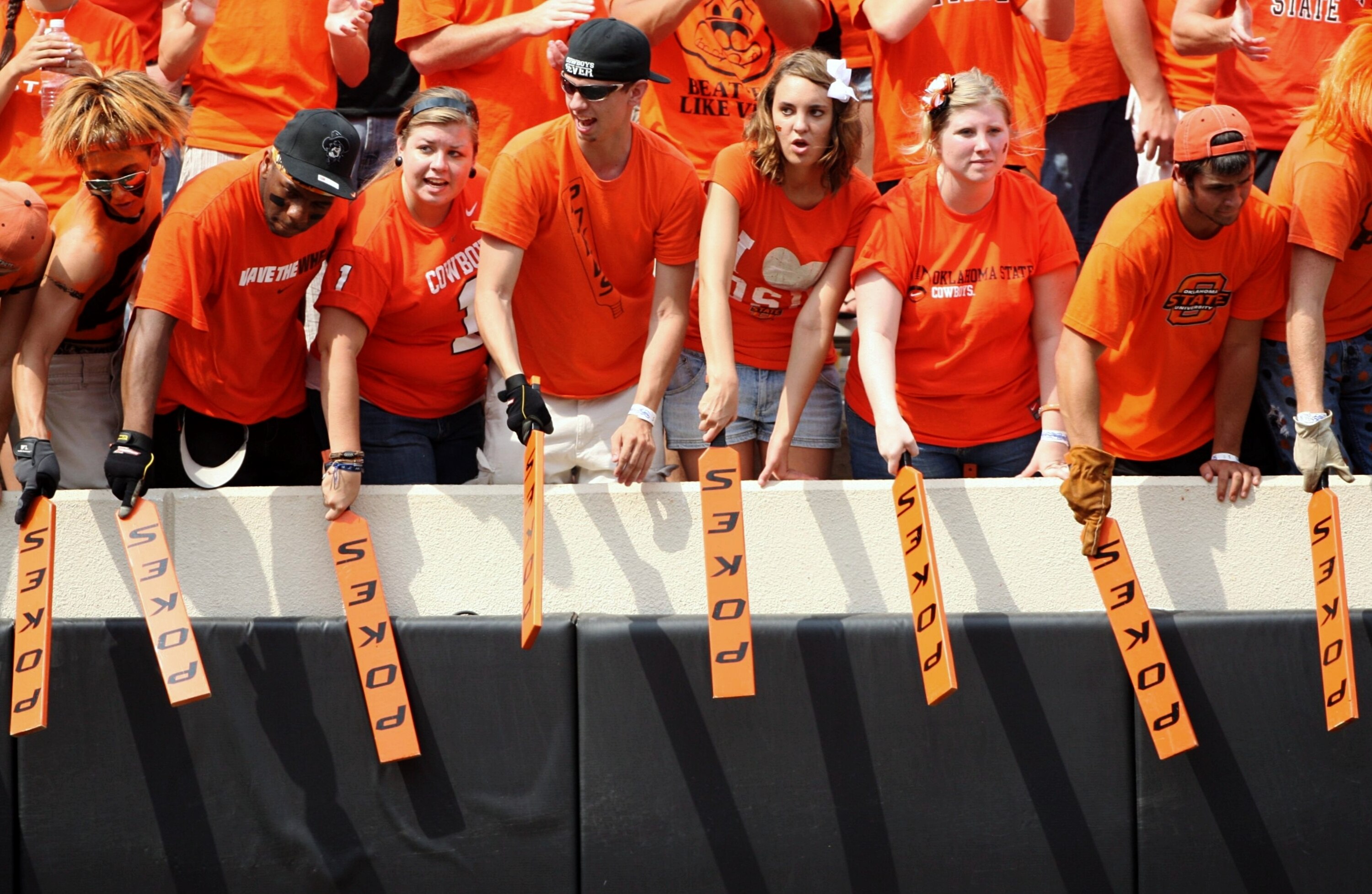 STILLWATER, OK - SEPTEMBER 5:  Fans of the Oklahoma State Cowboys cheer on their team in the second quarter of the game against the Georgia Bulldogs at Boone Pickens Stadium on September 5, 2009 in Stillwater, Oklahoma. (Photo by Christian Petersen/Getty