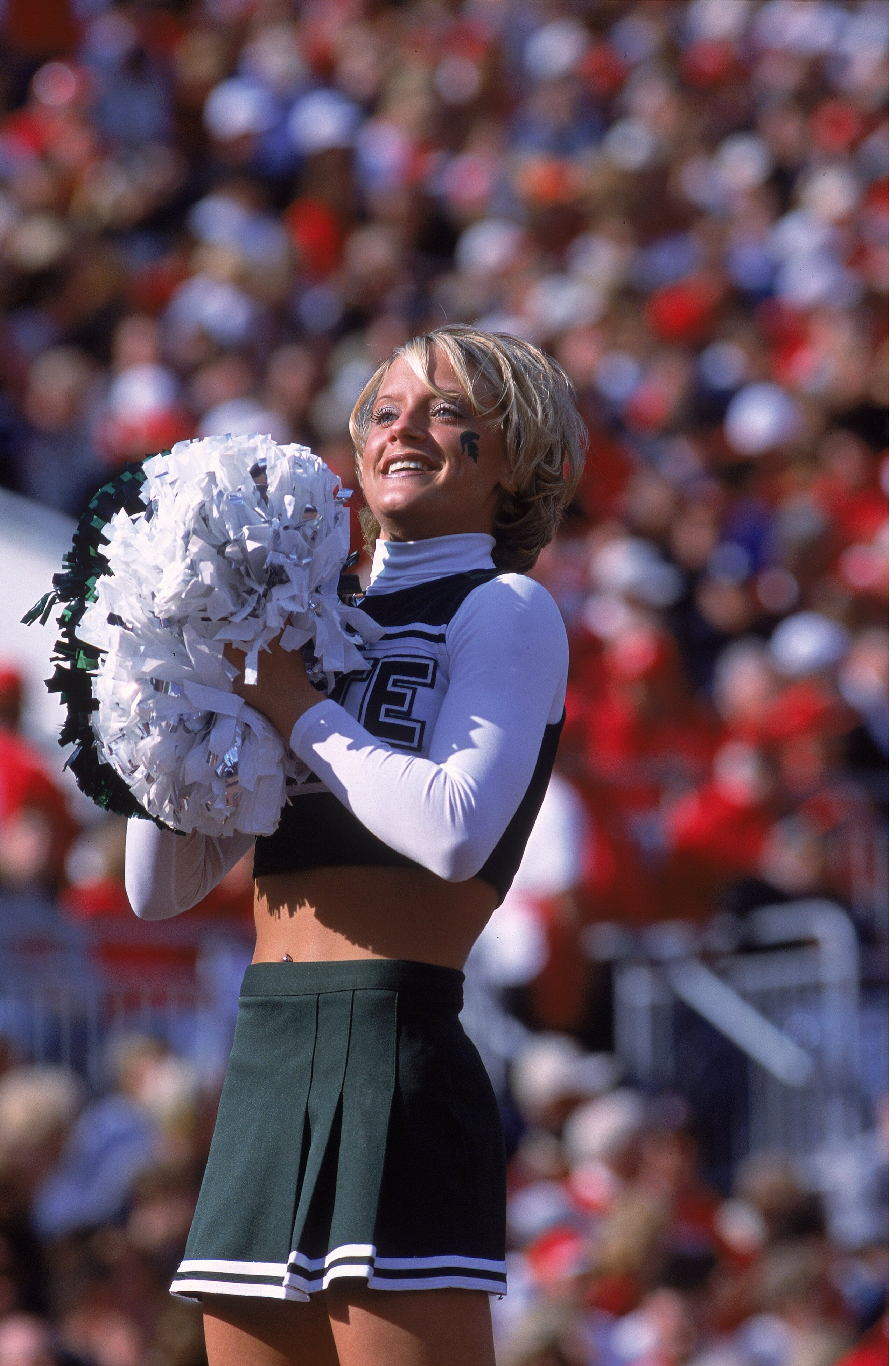 4 Nov 2000: A Cheerleader of the Michigan State Spartans smiles during the game against the Ohio State Buckeyes at the Ohio Stadium in Columbus, Ohio. The Spartans defeated the Buckeyes 27-13.Mandatory Credit: Tom Hauck /Allsport 4 Nov 2000: A Cheerleader of the Michigan State Spartans smiles during the game against the Ohio State Buckeyes at the Ohio Stadium in Columbus, Ohio. The Spartans defeated the Buckeyes 27-13.Mandatory Credit: Tom Hauck /Allsport