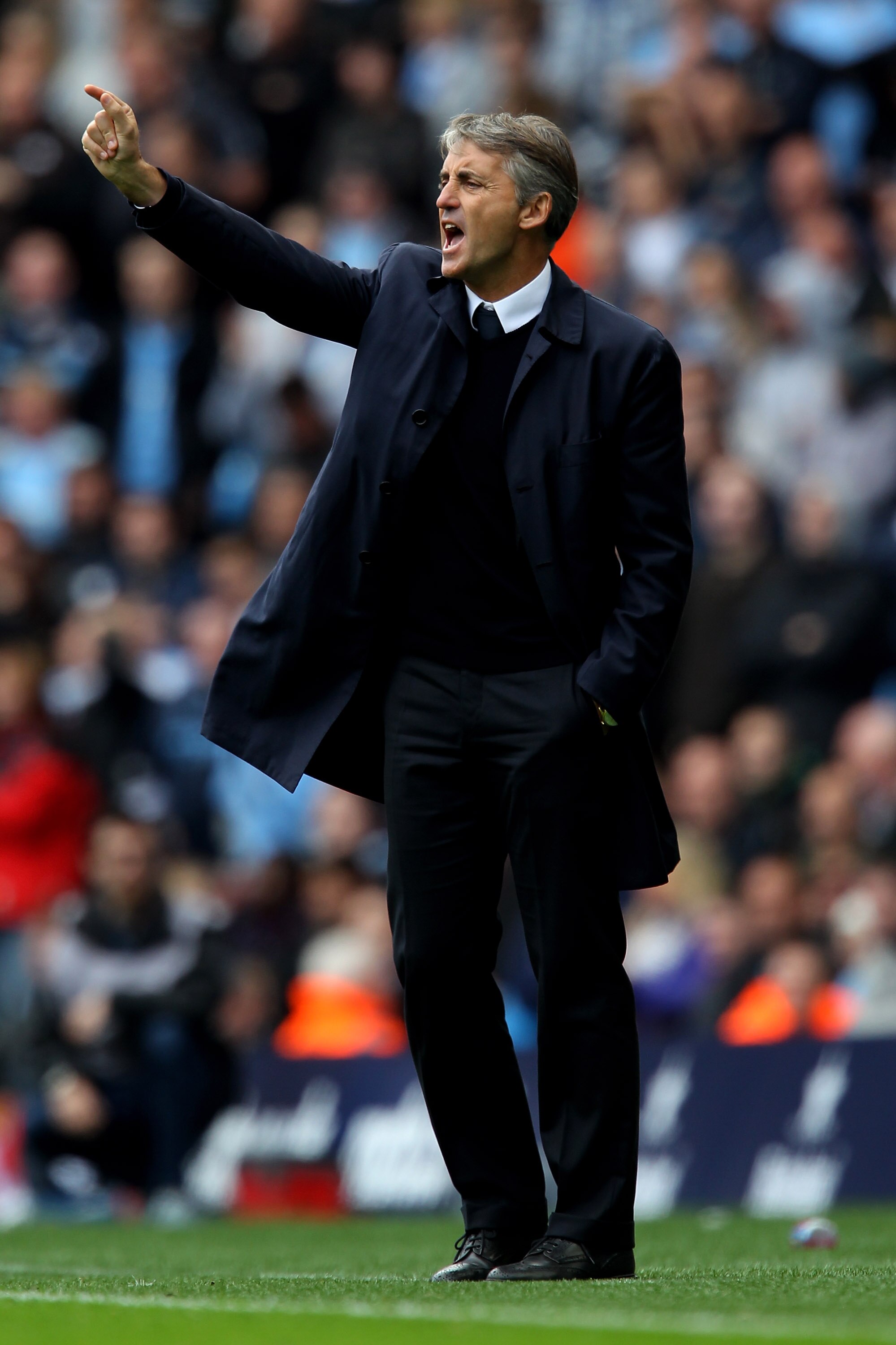 MANCHESTER, ENGLAND - SEPTEMBER 25:  Manchester City Manager Roberto Mancini issues instructions during the Barclays Premier League match between Manchester City and Chelsea at the City of Manchester Stadium on September 25, 2010 in Manchester, England.