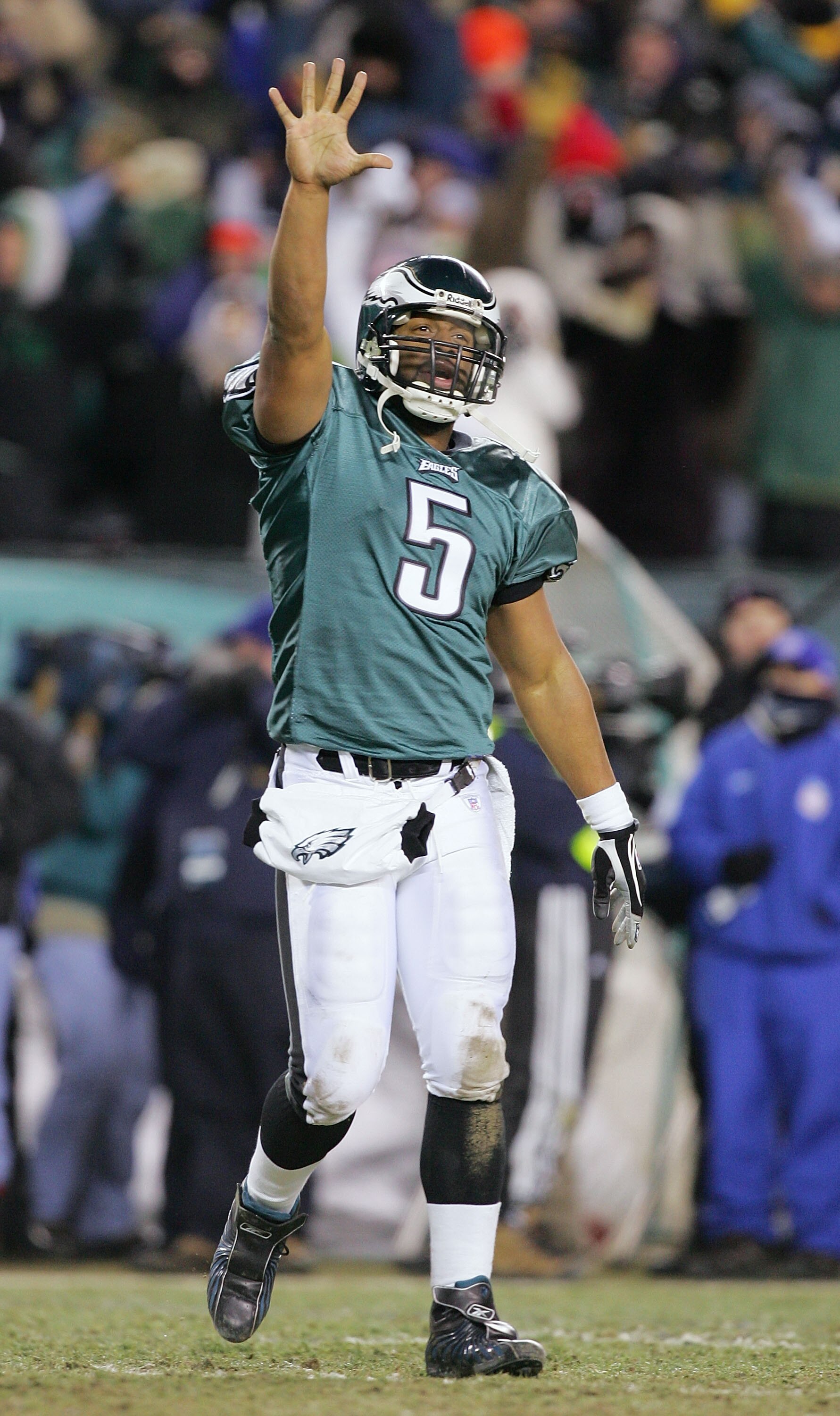 PHILADELPHIA - JANUARY 23:  Quarterback Donovan McNabb #5 of the Philadelphia Eagles celebrates after throwing a 2-yard touchdown pass to tightend Chad Lewis #89 against the Atlanta Falcons in the fourth quarter during the NFC Championship game at Lincoln