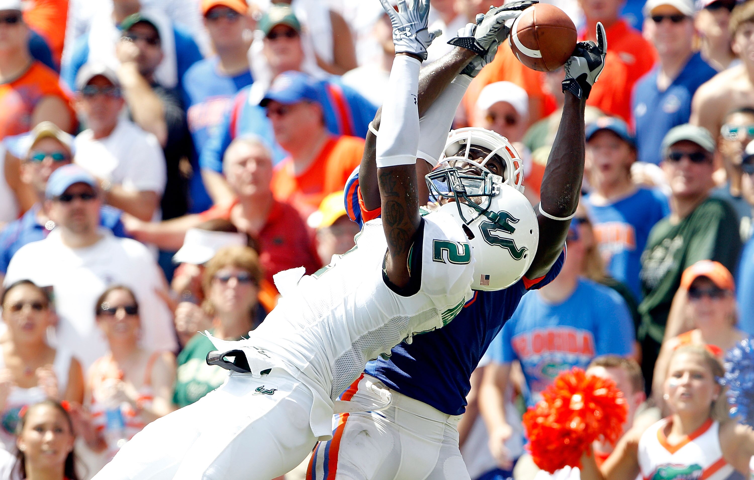 GAINESVILLE, FL - SEPTEMBER 11:  Deonte Thompson #6 of the Florida Gators attempts to make a catch over Quenton Washington #2 of the South Florida Bulls during a game at Ben Hill Griffin Stadium on September 11, 2010 in Gainesville, Florida.  (Photo by Sa