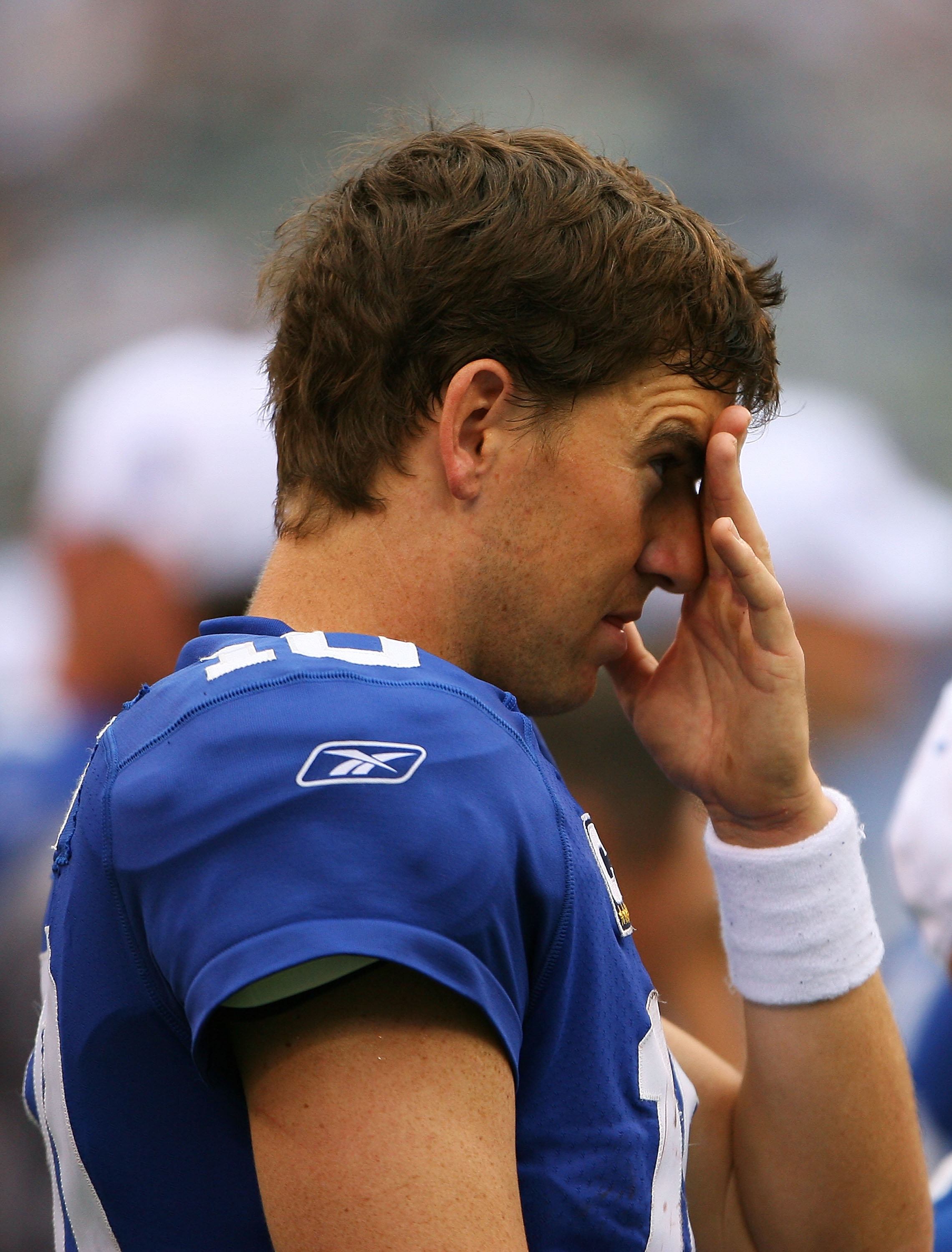 EAST RUTHERFORD, NJ - SEPTEMBER 26:  Eli Manning #10 of the New York Giants watches during the last minutes of the Giants game against the Tennessee Titans at New Meadowlands Stadium on September 26, 2010 in East Rutherford, New Jersey. The Titans beat th