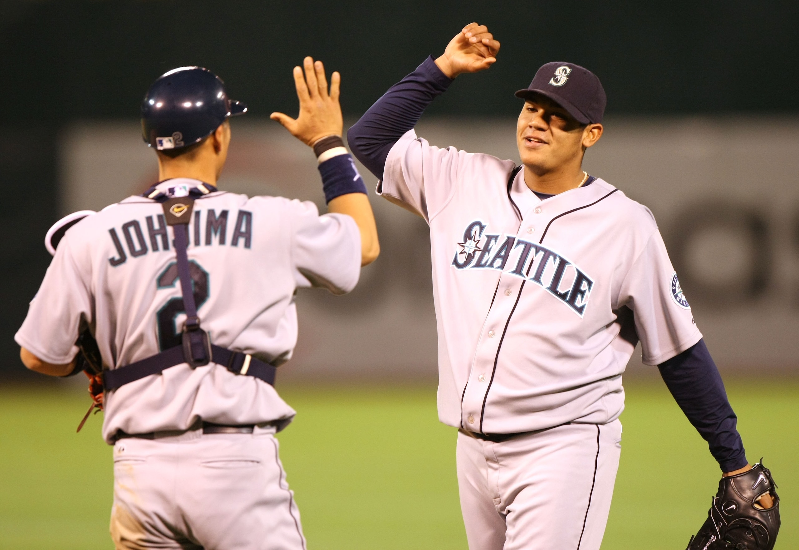 OAKLAND, CA - APRIL 16:  Felix Hernandez #34 and Kenji Johjima #2 of the Seattle Mariners celebrate after defeating the Oakland Athletics during a Major League Baseball game on April 16, 2008 at McAfee Coliseum in Oakland, California.  (Photo by Jed Jacob