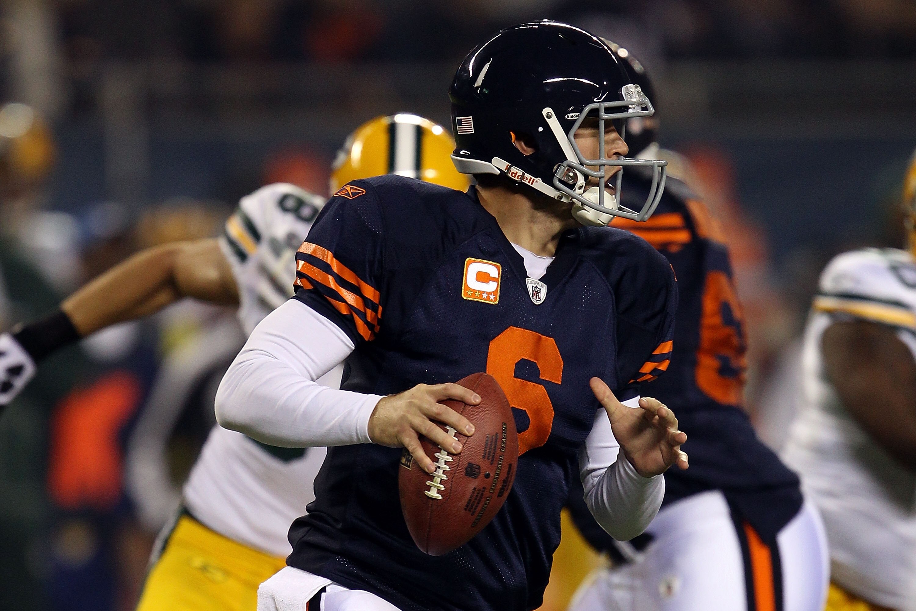 CHICAGO - SEPTEMBER 27:  Jay Cutler #6 of the Chicago Bears rolls out to pass in the first quarter against the Green Bay Packers at Soldier Field on September 27, 2010 in Chicago, Illinois.  (Photo by Jonathan Daniel/Getty Images)