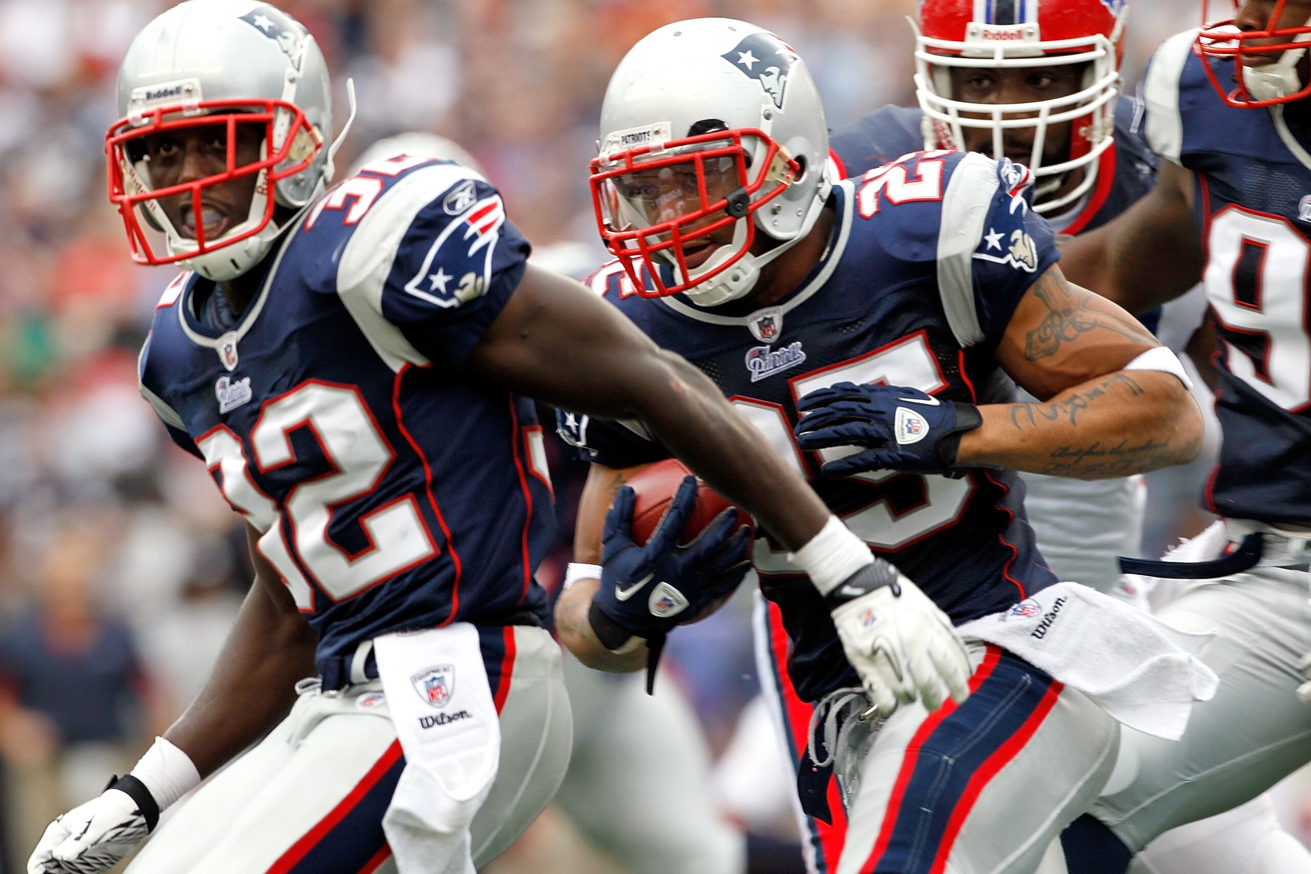 FOXBORO, MA - SEPTEMBER 26:  Devin McCourty #32 of the New England Patriots blocks for teammate Patrick Chung #25  after Chung intercepted a pass against the Buffalo Bills in the second half at Gillette Stadium on September 26, 2010 in Foxboro, Massachuse