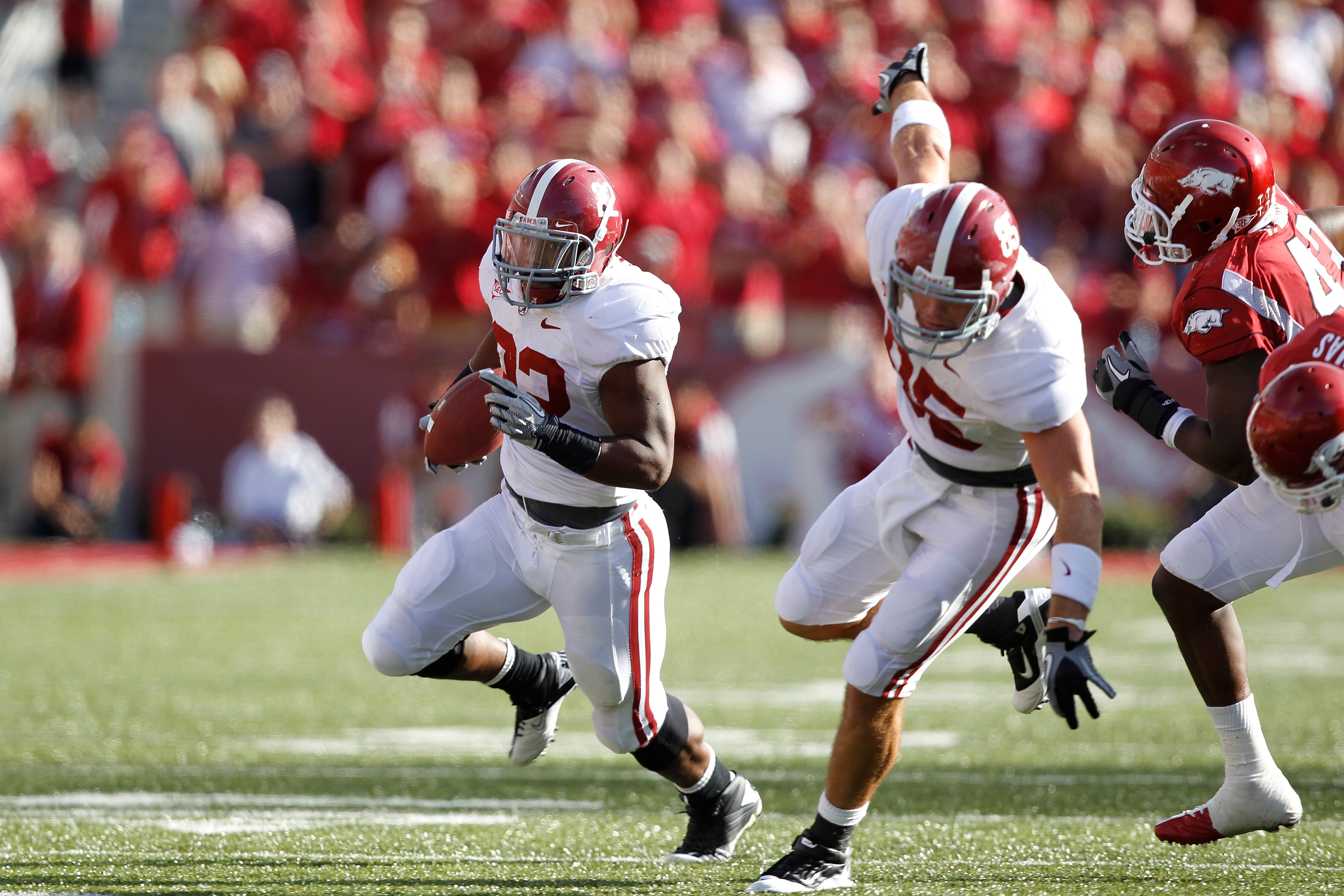 FAYETTEVILLE - SEPTEMBER 25: Mark Ingram #22 of the Alabama Crimson Tide runs the ball against the Arkansas Razorbacks at Donald W. Reynolds Razorback Stadium on September 25, 2010 in Fayetteville, Arkansas. Alabama won 24-20. (Photo by Joe Robbins/Getty 