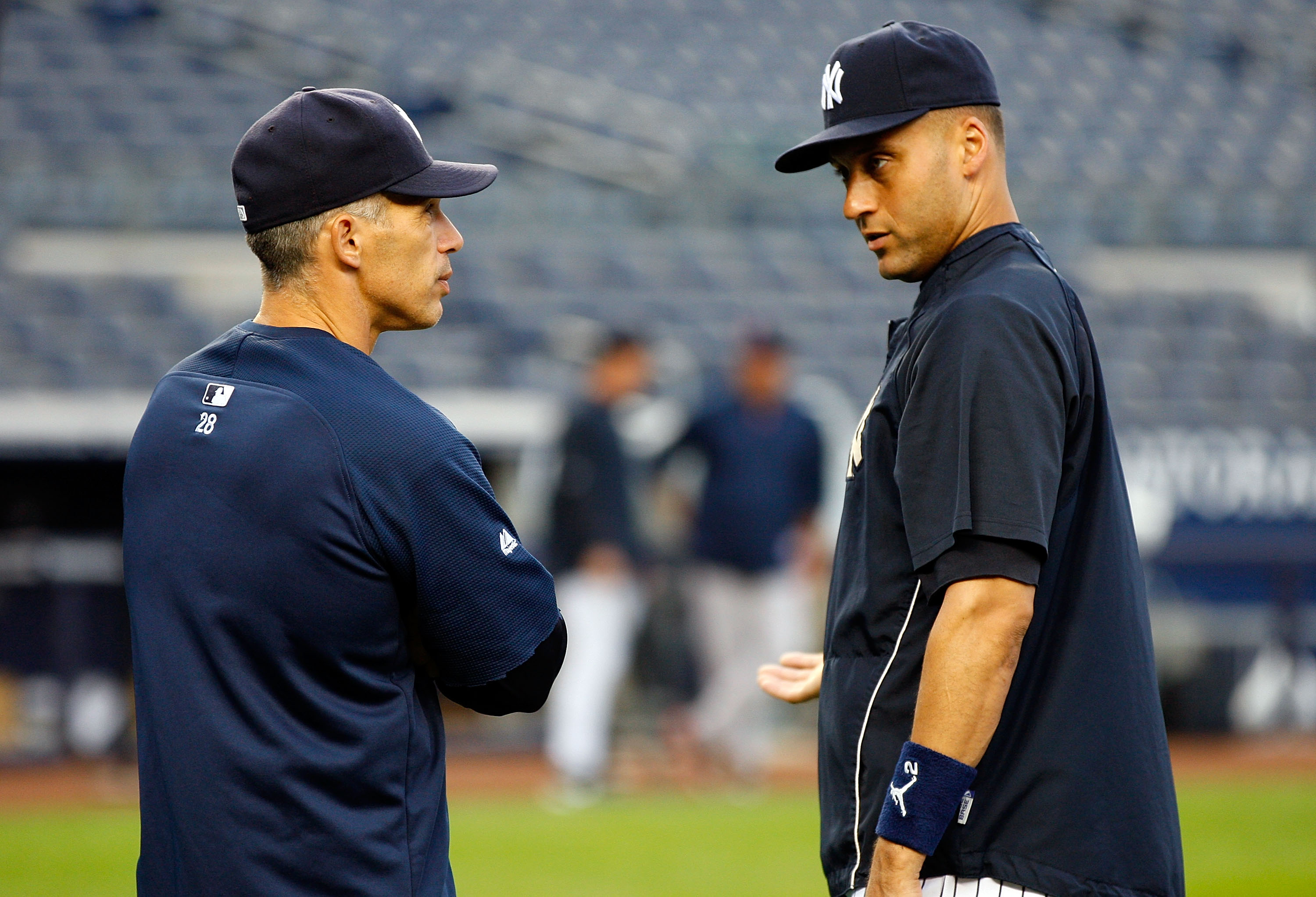 NEW YORK - SEPTEMBER 26: Manager Joe Girardi #28 and Derek Jeter #2 of the New York Yankees talk during warm-ups prior to their game against the Boston Red Sox on September 26, 2010 at Yankee Stadium in the Bronx borough of New York City. (Photo by Mike NEW YORK - SEPTEMBER 26: Manager Joe Girardi #28 and Derek Jeter #2 of the New York Yankees talk during warm-ups prior to their game against the Boston Red Sox on September 26, 2010 at Yankee Stadium in the Bronx borough of New York City. (Photo by Mike