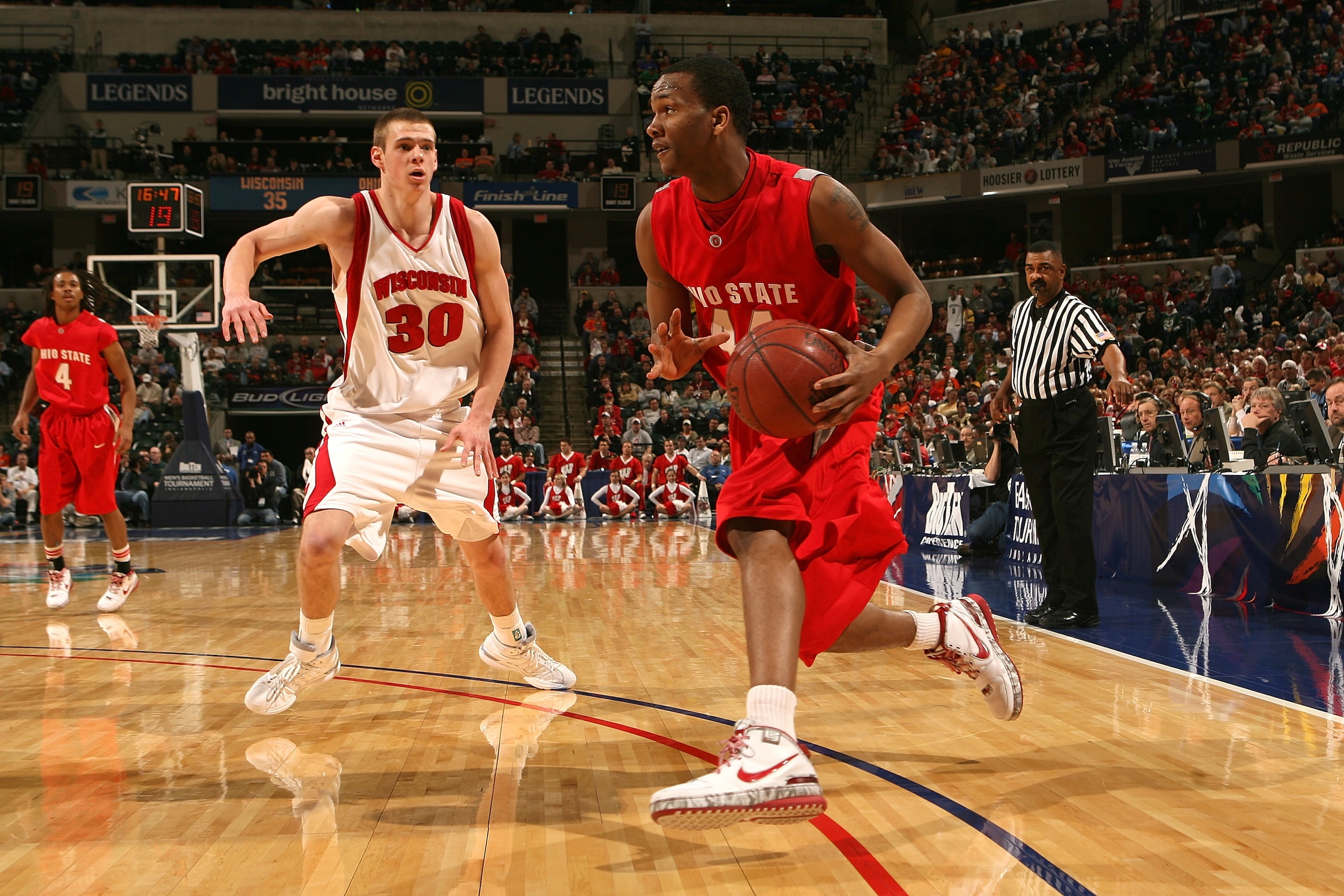 INDIANAPOLIS - MARCH 13:  William Buford #44 of the Ohio State Buckeyes drives against Jon Leuer #30 of the Wisconsin Badgers  during the second round of the Big Ten Men's Basketball Tournament at Conseco Fieldhouse on March 13, 2009 in Indianapolis, Indi