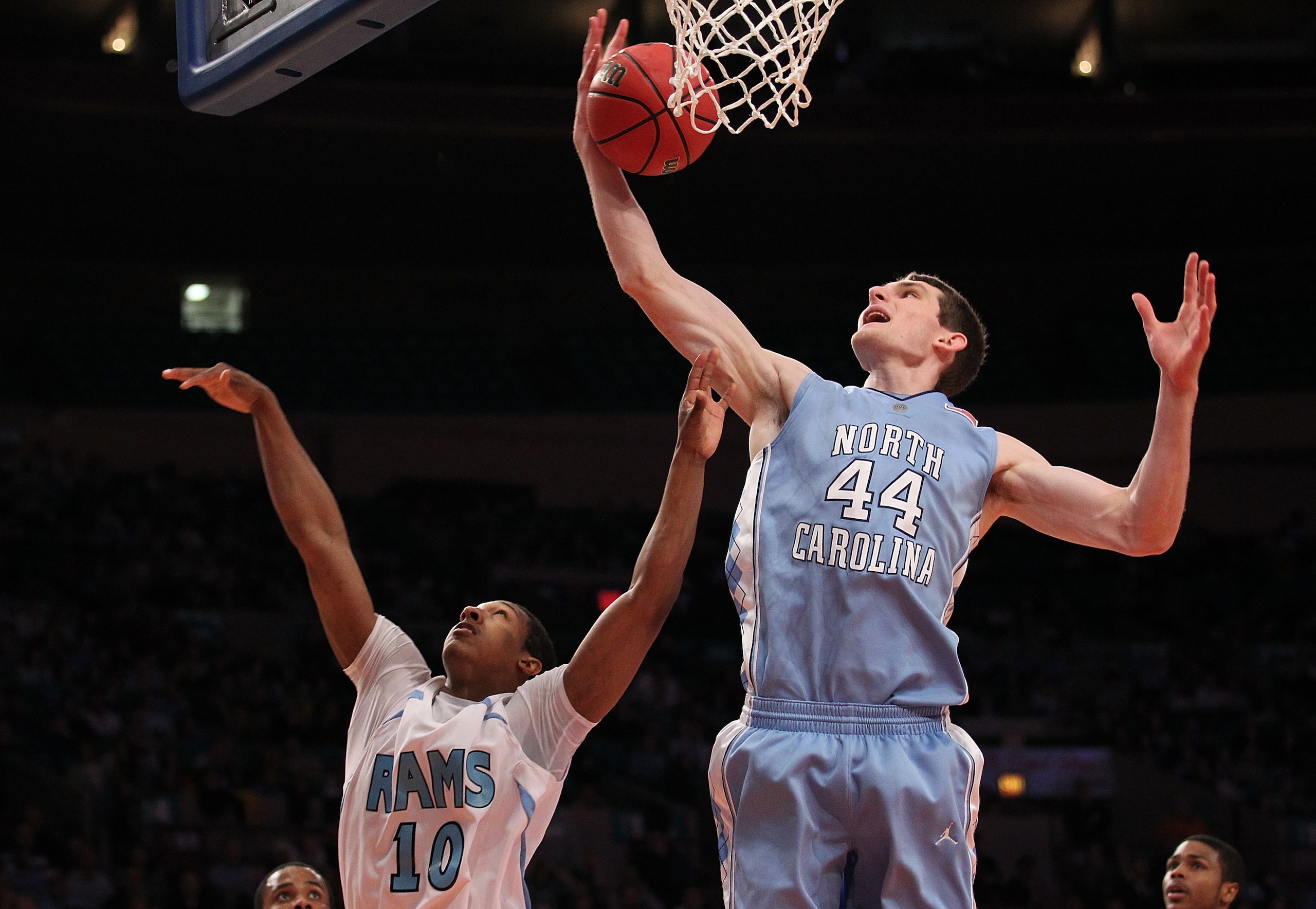 NEW YORK - MARCH 30:  Tyler Zeller #44 of the North Carolina Tar Heels grabs a rebound over Akeem Richmond #10 of the Rhode Island Rams at Madison Square Garden on March 30, 2010 in New York, New York.  (Photo by Nick Laham/Getty Images)