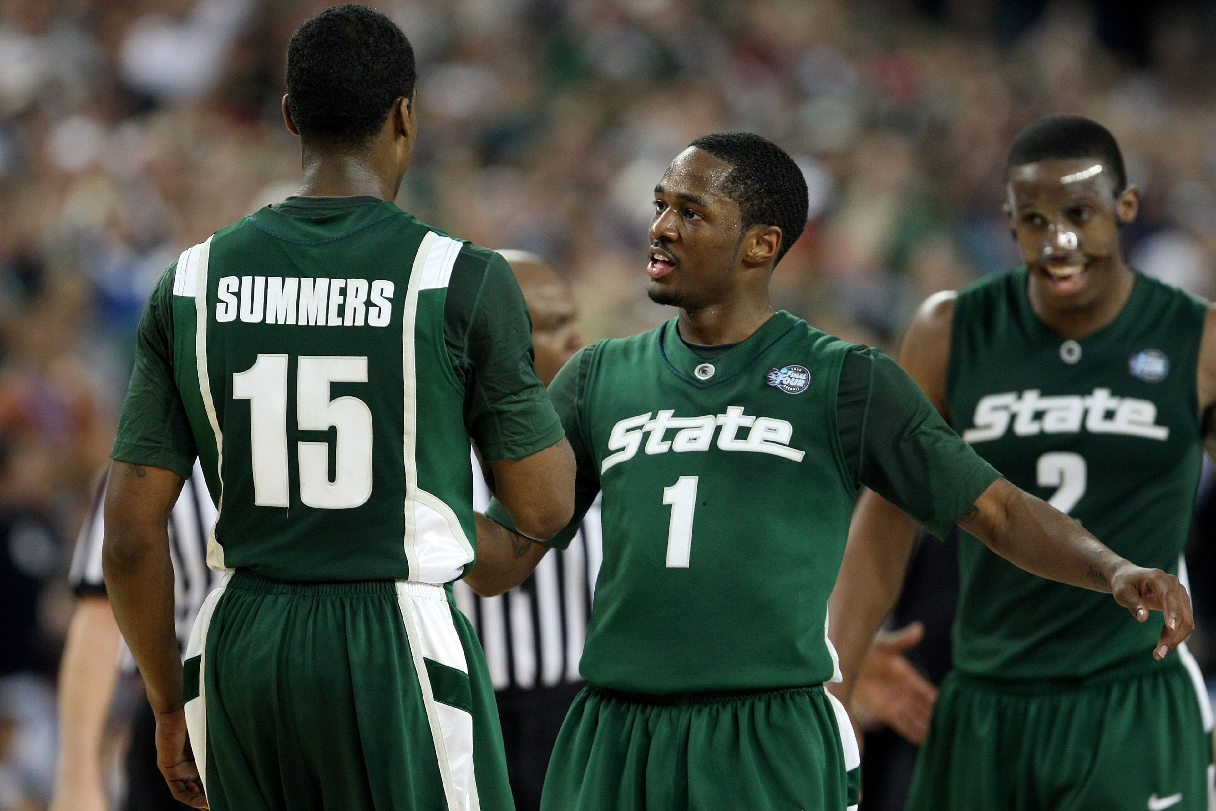 DETROIT - APRIL 04:  (L-R) Durrell Summers #15, Kalin Lucas #1 and Raymar Morgan #2 of the Michigan State Spartans celebrate late in the second halfagainst the Connecticut Huskies during the National Semifinal game of the NCAA Division I Men's Basketball