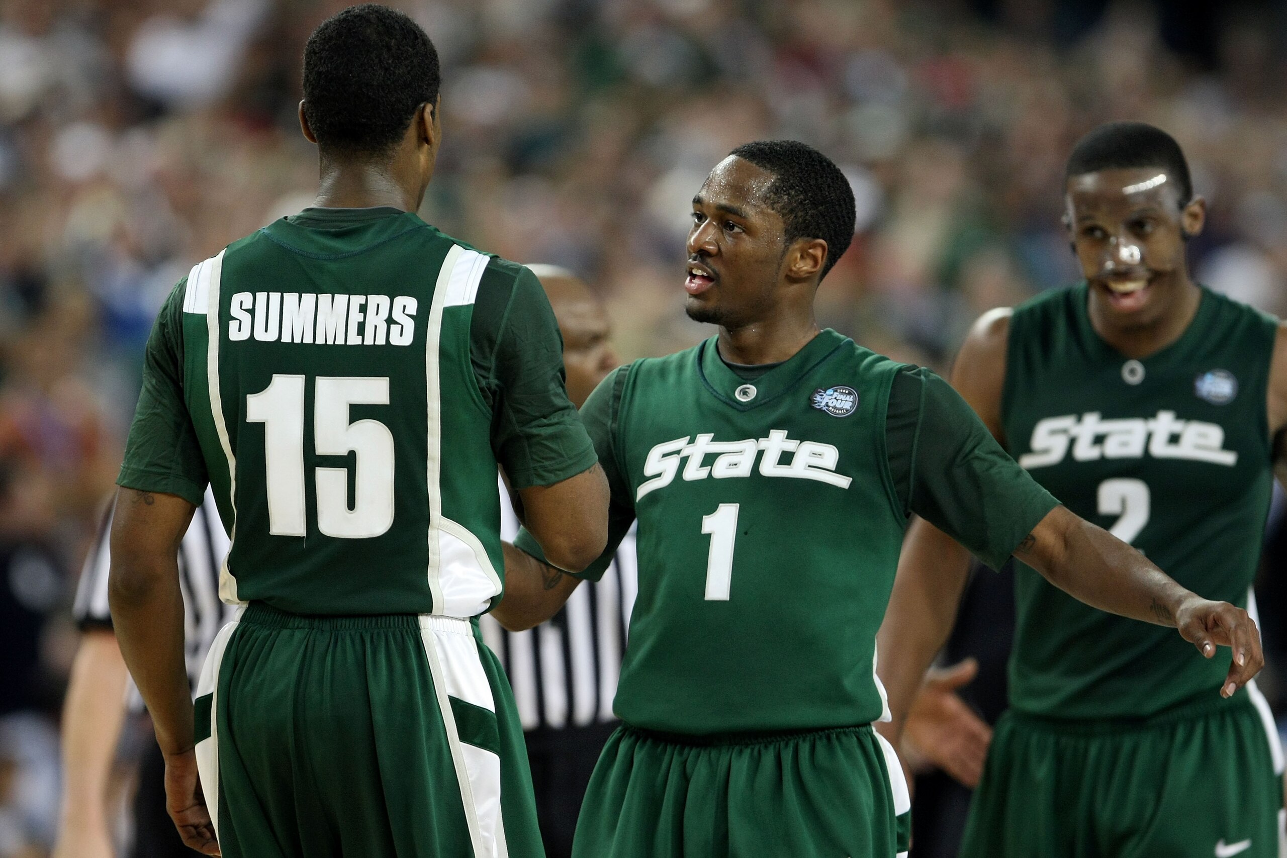 DETROIT - APRIL 04:  (L-R) Durrell Summers #15, Kalin Lucas #1 and Raymar Morgan #2 of the Michigan State Spartans celebrate late in the second halfagainst the Connecticut Huskies during the National Semifinal game of the NCAA Division I Men's Basketball