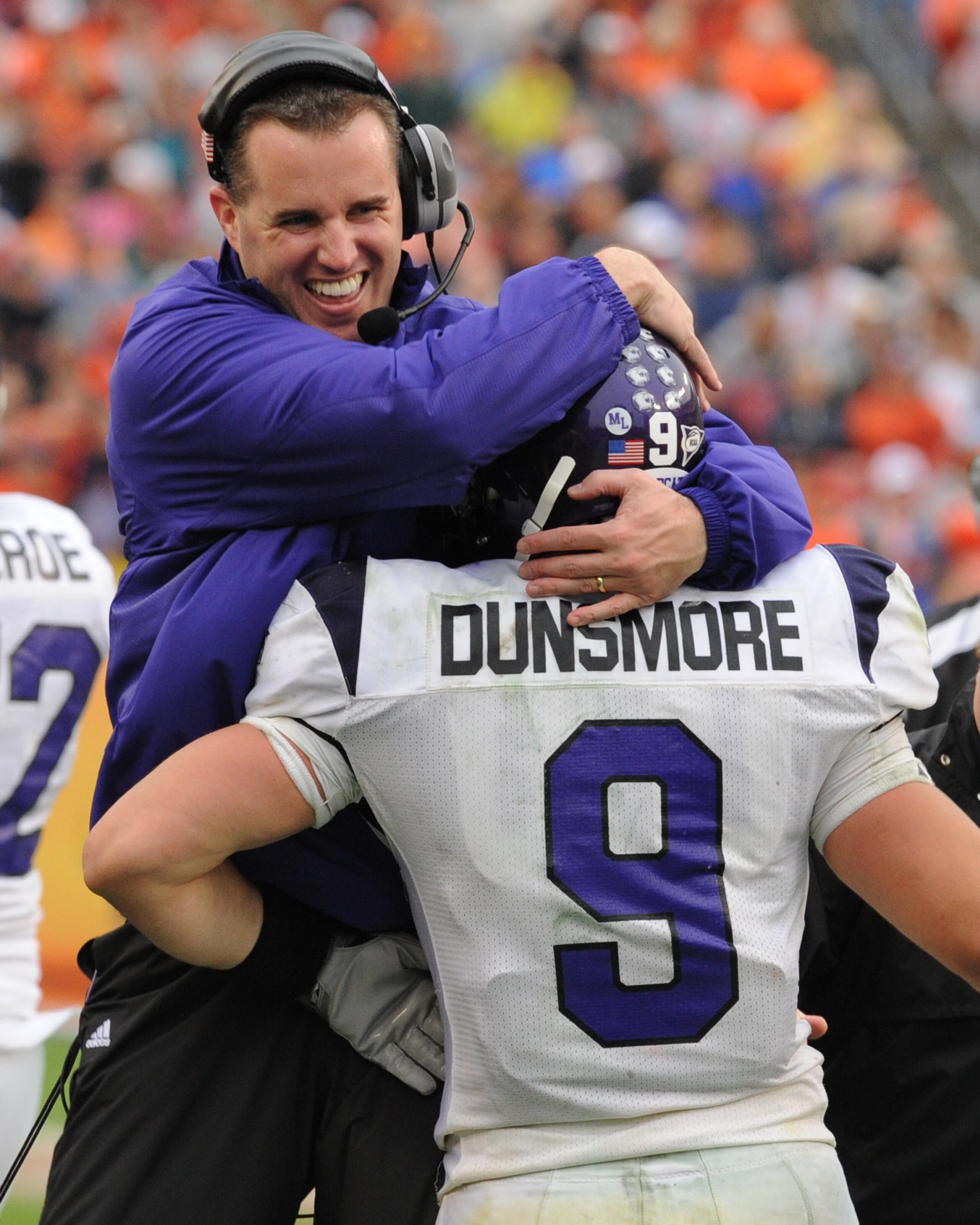 TAMPA, FL - JANUARY 1: Coach Pat Fitzgerald of the Northwestern Wildcats celebrates a touchdown catch by split back Drake Dunsmore #9 against the Auburn Tigers in the Outback Bowl January 1, 2010 at Raymond James Stadium in Tampa, Florida. (Photo by Al M TAMPA, FL - JANUARY 1: Coach Pat Fitzgerald of the Northwestern Wildcats celebrates a touchdown catch by split back Drake Dunsmore #9 against the Auburn Tigers in the Outback Bowl January 1, 2010 at Raymond James Stadium in Tampa, Florida. (Photo by Al M
