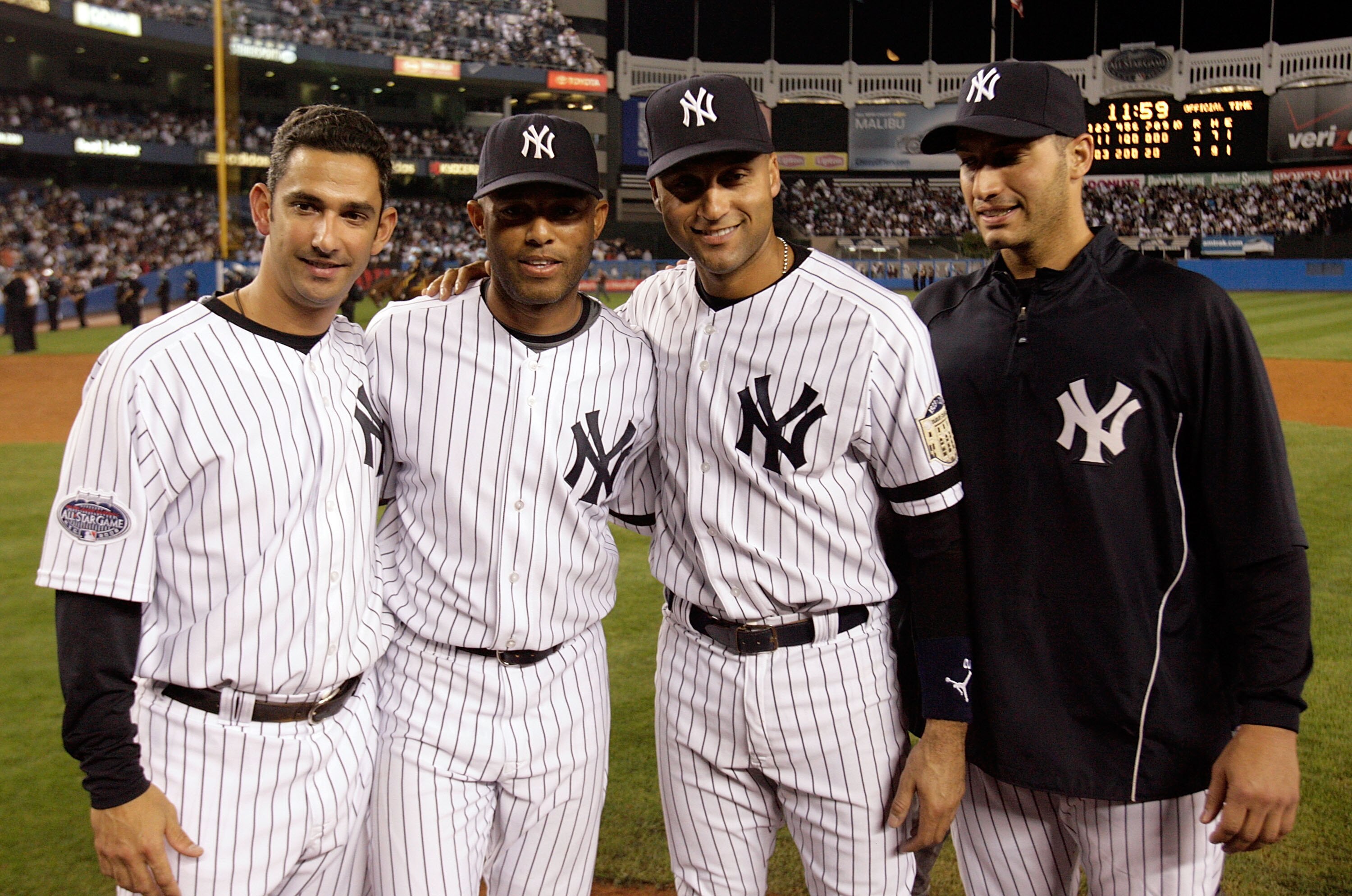 NEW YORK - SEPTEMBER 21: (L-R) Jorge Posada #20, Mariano Rivera #42, Derek Jeter #2 and Andy Pettitte #46 pose for a photograph after defeating the Baltimore Orioles of the New York Yankees during the last regular season game at Yankee Stadium on Septemb NEW YORK - SEPTEMBER 21: (L-R) Jorge Posada #20, Mariano Rivera #42, Derek Jeter #2 and Andy Pettitte #46 pose for a photograph after defeating the Baltimore Orioles of the New York Yankees during the last regular season game at Yankee Stadium on Septemb
