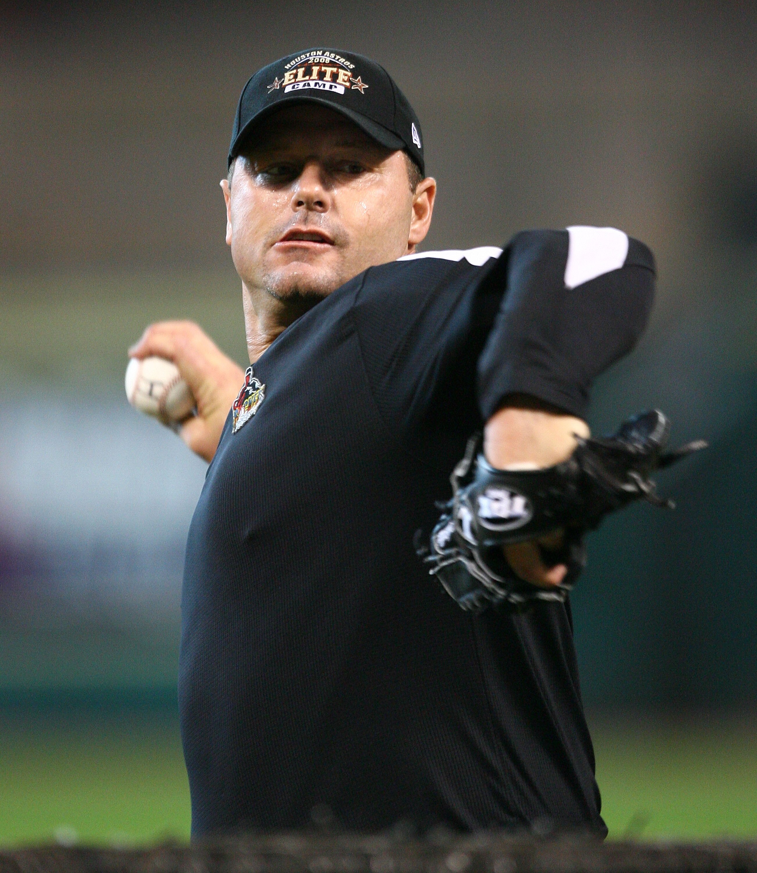 HOUSTON - JANUARY 31:  Roger Clemens pitches during batting practice at the Nolan Ryan and Jeff Bagwell Elite Camp on January 31, 2008 at the Minute Maid Park in Houston, Texas.  (Photo by Bob Levey/Getty Images)