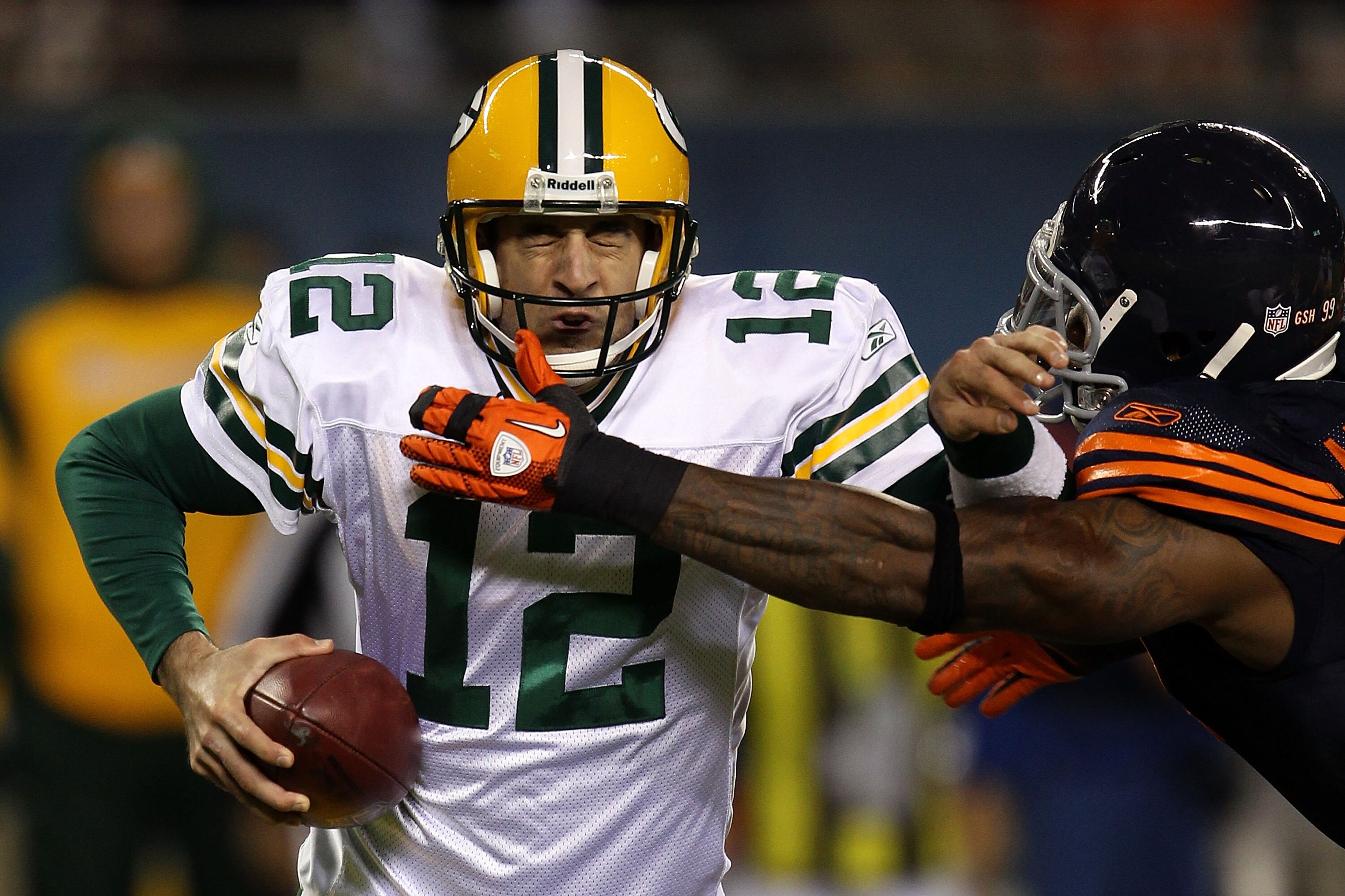 CHICAGO - SEPTEMBER 27: Aaron Rodgers #12 of the Green Bay Packers attempts to escape pressure from Mark Anderson #97 of the Chicago Bears in the first half at Soldier Field on September 27, 2010 in Chicago, Illinois. (Photo by Jonathan Daniel/Getty Ima CHICAGO - SEPTEMBER 27: Aaron Rodgers #12 of the Green Bay Packers attempts to escape pressure from Mark Anderson #97 of the Chicago Bears in the first half at Soldier Field on September 27, 2010 in Chicago, Illinois. (Photo by Jonathan Daniel/Getty Ima