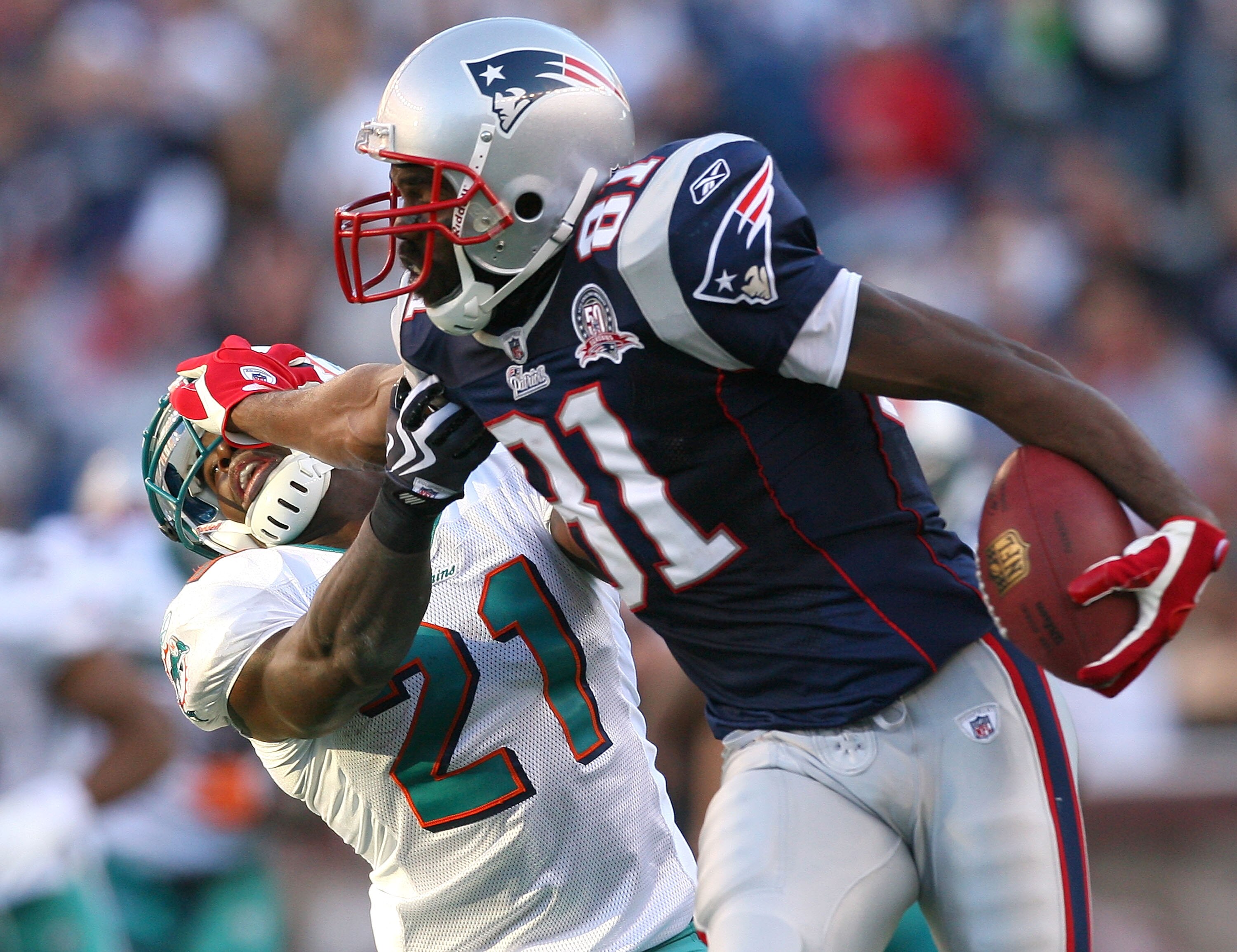 FOXBORO, MA - NOVEMBER 8: Randy Moss #81 of the New England Patriots gains yards against the defense of Vontae Davis of the Miami Dolphins at Gillette Stadium on November 8, 2009 in Foxboro, Massachusetts. The Patriots won 27-17. (Photo by Jim Rogash/Get FOXBORO, MA - NOVEMBER 8: Randy Moss #81 of the New England Patriots gains yards against the defense of Vontae Davis of the Miami Dolphins at Gillette Stadium on November 8, 2009 in Foxboro, Massachusetts. The Patriots won 27-17. (Photo by Jim Rogash/Get