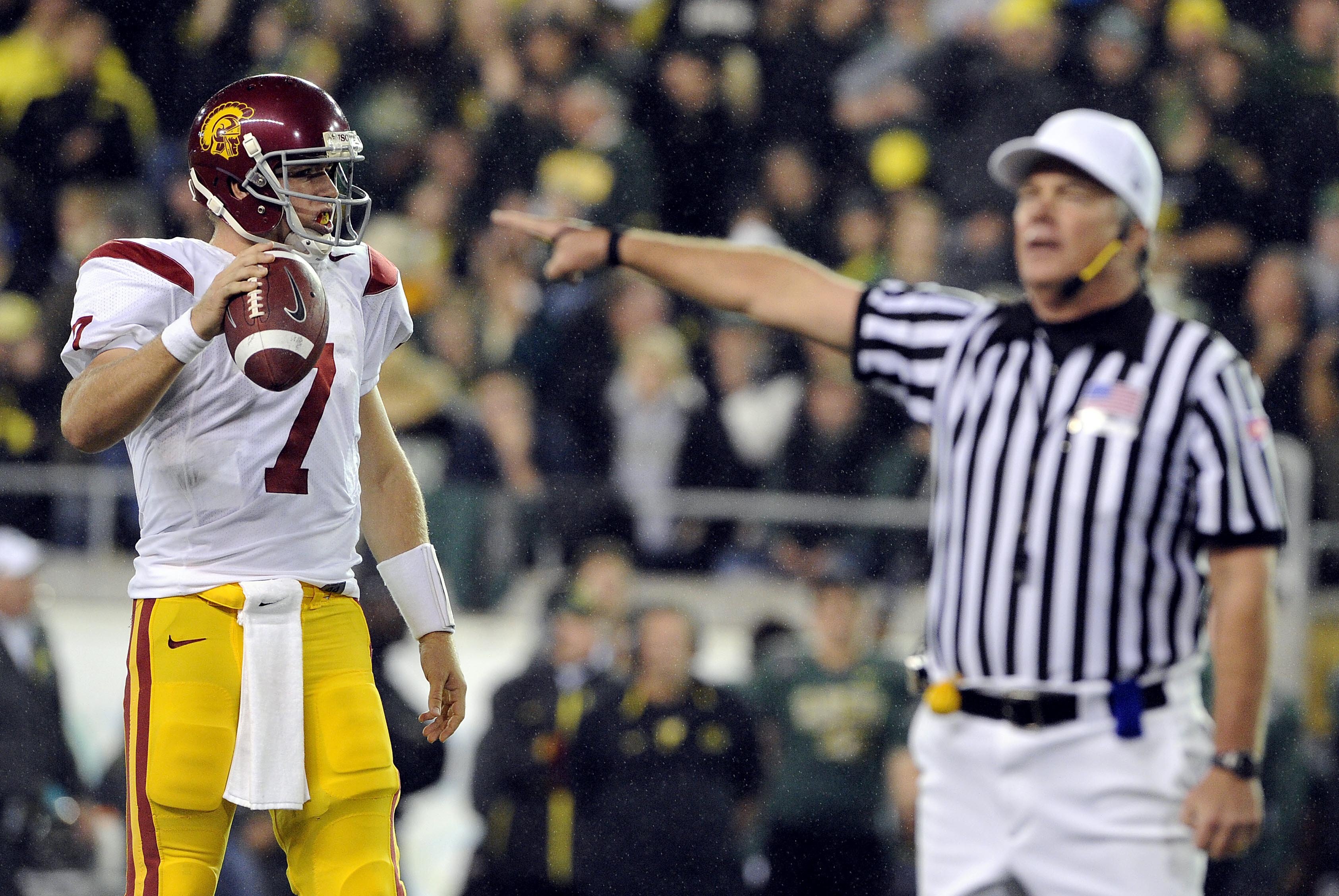EUGENE, OR - OCTOBER 31: Quarterback Matt Barkley #7 of the USC Trojans is not happy after as an official calla a false start on the Trojans in the second quarter of the game against the Oregon Ducks at Autzen Stadium on October 31, 2009 in Eugene, Oregon