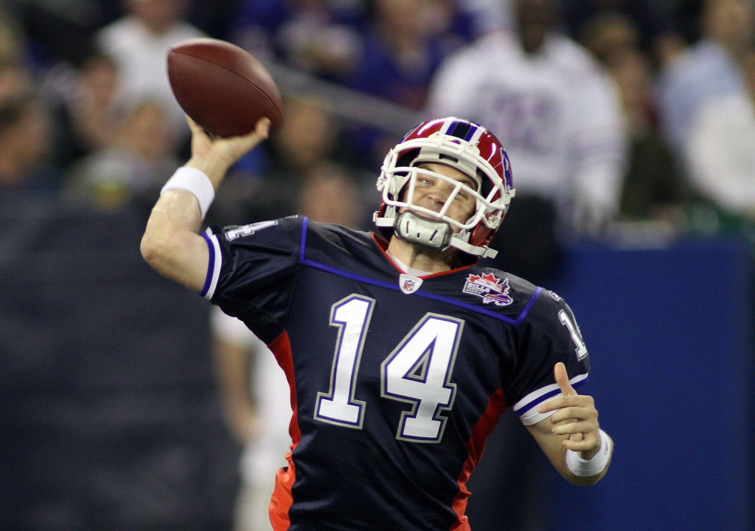 TORONTO - DECEMBER 3:  Quarterback Ryan Fitzpatrick #14 of the Buffalo Bills passes the ball during their NFL game against the New York Jets on December 3, 2009  at Rogers Centre in Toronto, Ontario, Canada. The Jets defeated the Bills 19-13. (Photo by Ri
