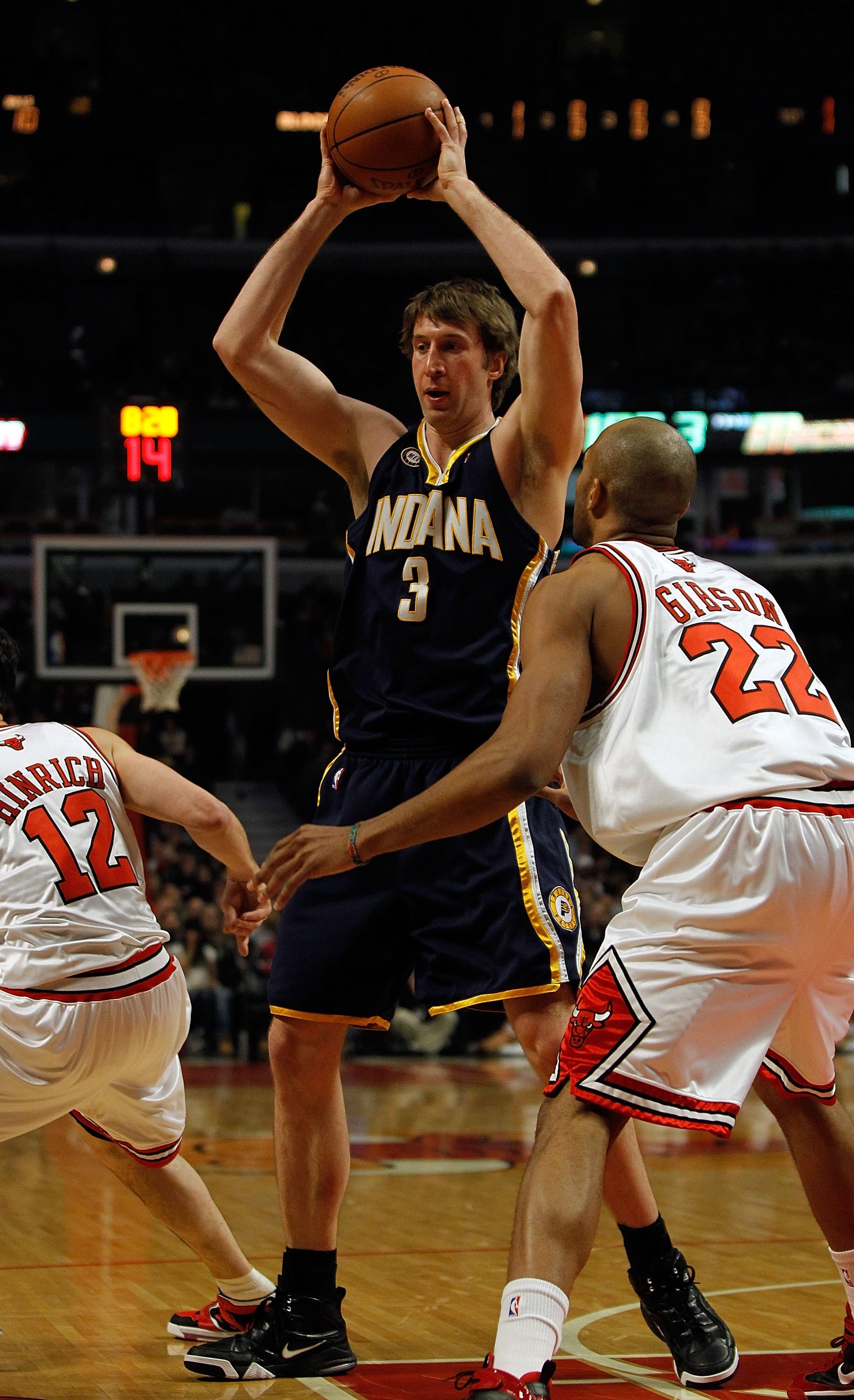 CHICAGO - FEBRUARY 24: Troy Murphy #3 of the Indiana Pacers looks to pass over Taj Gibson #22 of the Chicago Bulls at the United Center on February 24, 2010 in Chicago, Illinois. The Bulls defeated the Pacers 120-110. NOTE TO USER: User expressly acknowle