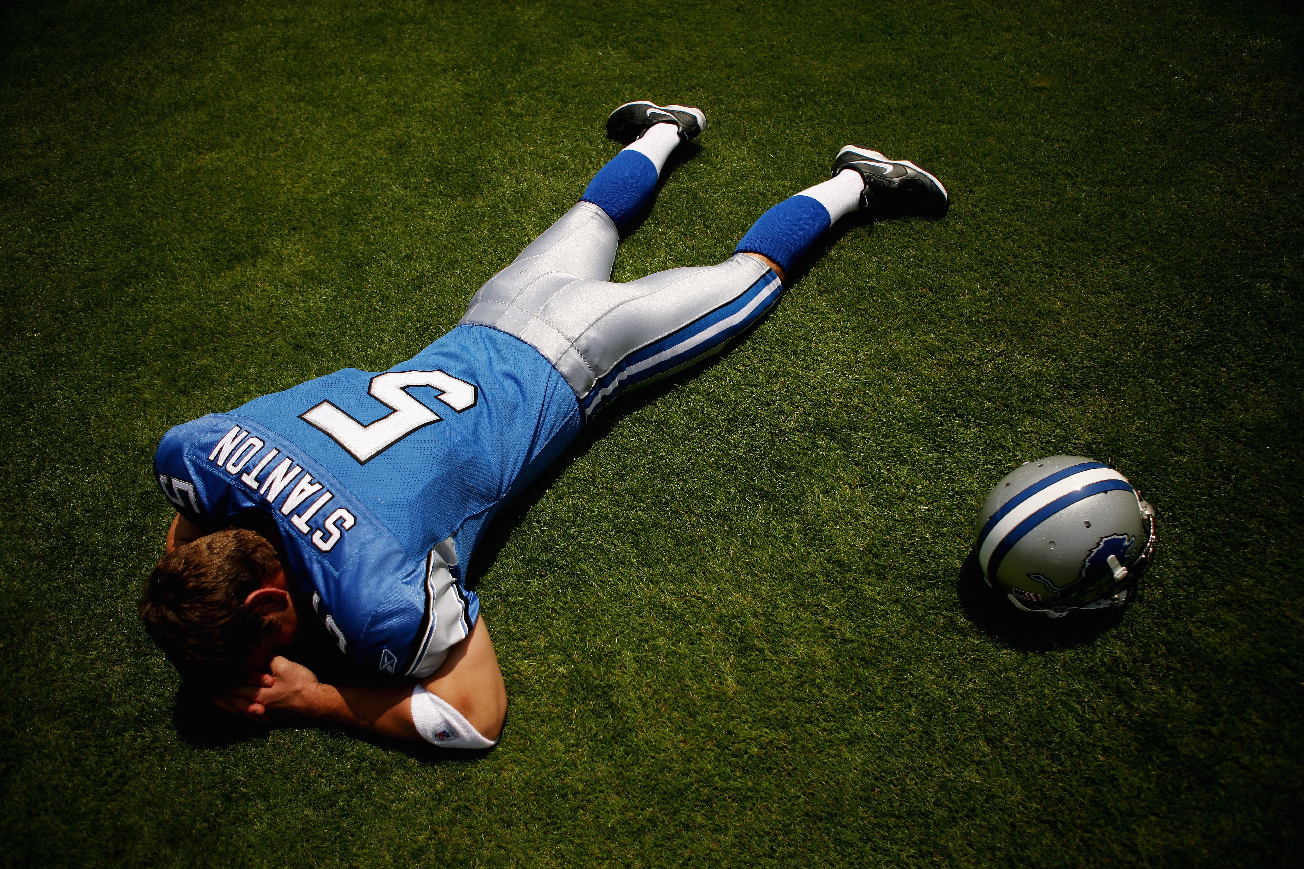 LOS ANGELES, CA - MAY 19: Quarterback, Drew Stanton #5 of the Detroit Lions lays on the field at the 2007 NFL Players Rookie Premiere on May 19, 2007 at the Los Angeles Memorial Coliseum in Los Angeles, California. (Photo by Nick Laham/Getty Images)