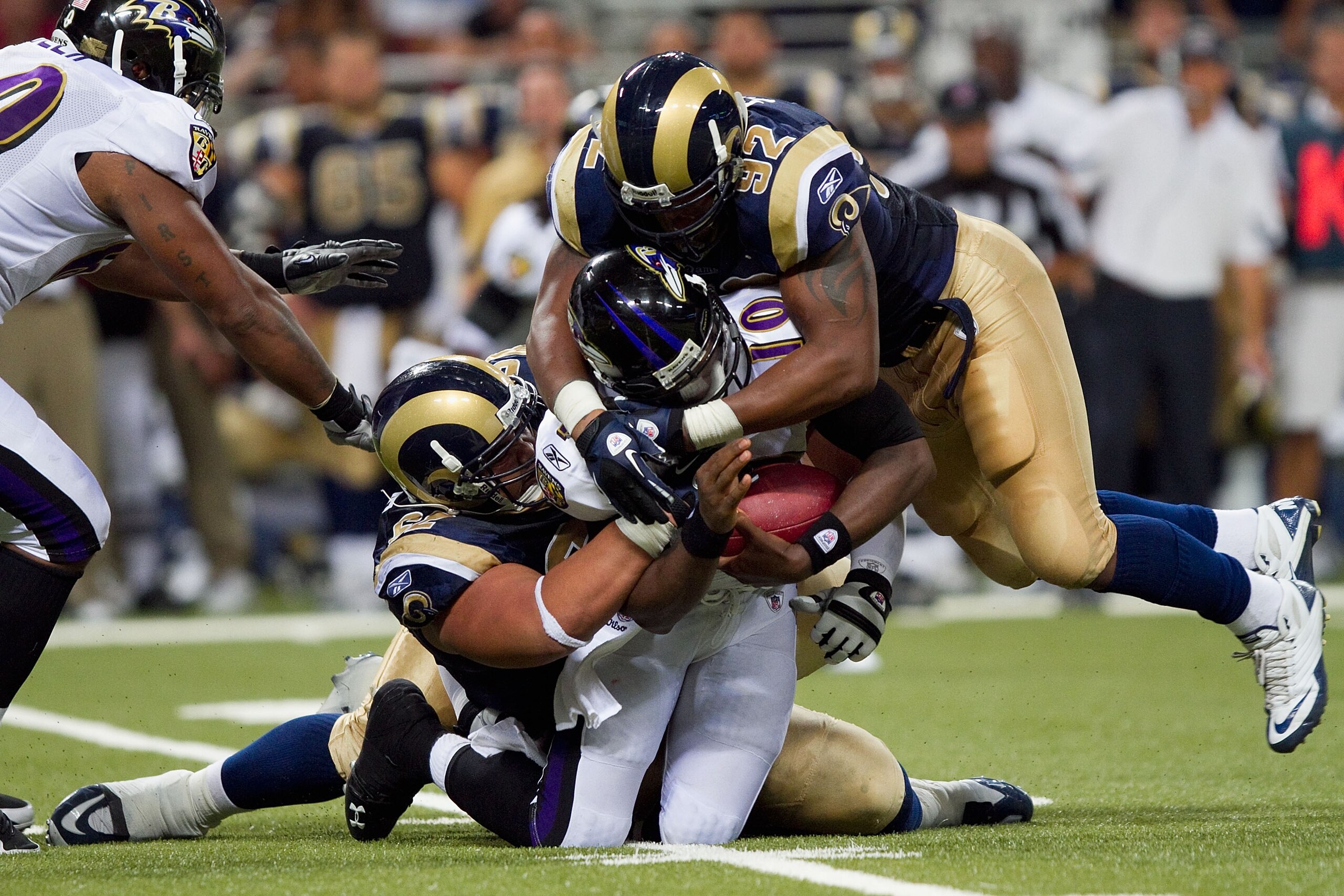 ST. LOUIS - SEPTEMBER 2: Eugene Sims #92 of the St. Louis Rams sacks Troy Smith #10 of the Baltimore Ravens during an NFL preseason game at the Edward Jones Dome on September 2, 2010 in St. Louis, Missouri.  The Rams beat the Ravens 27-21.  (Photo by Dili