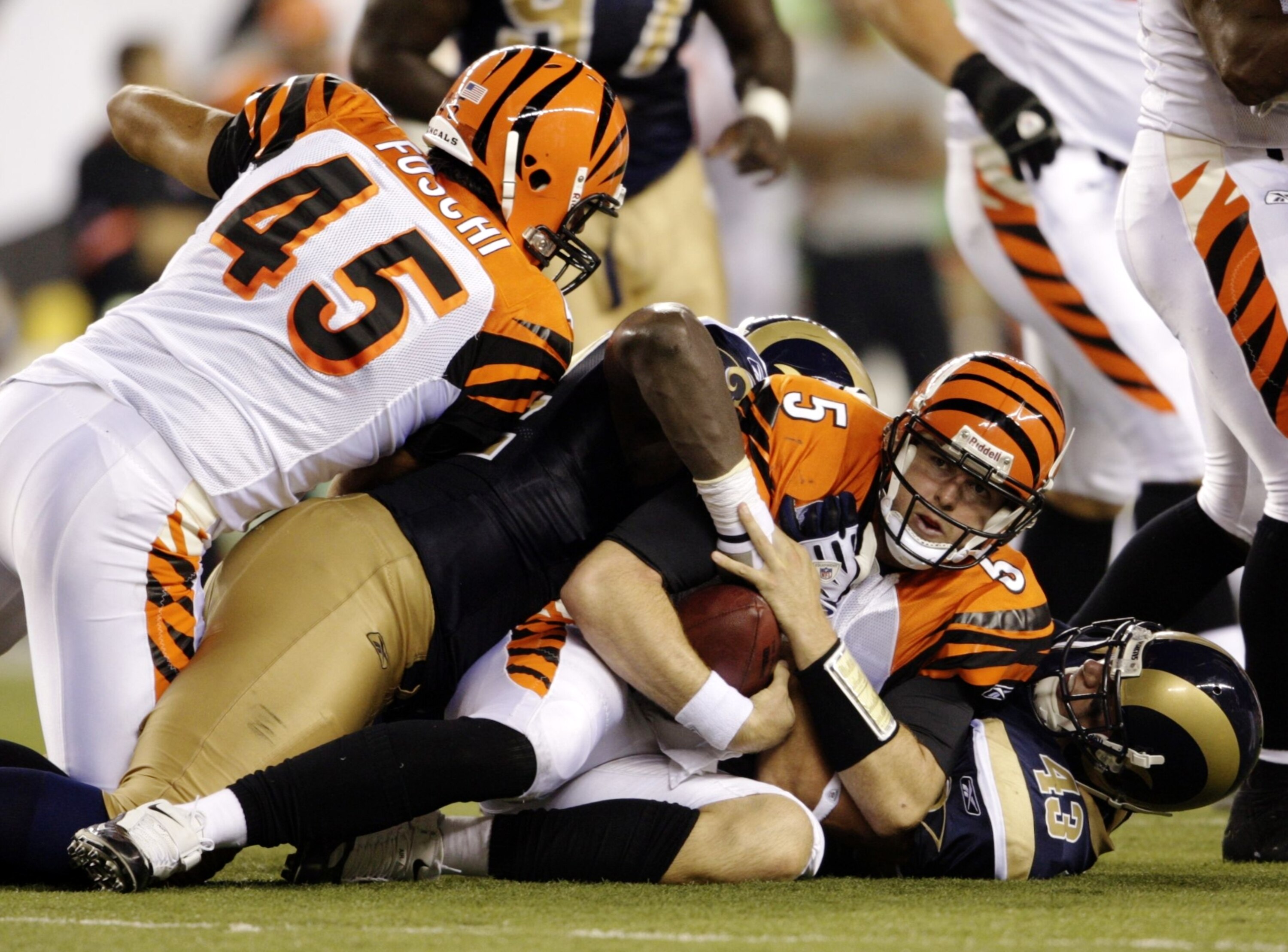 CINCINNATI, OH - AUGUST 27:  Quarterback Jordan Palmer #5 of the Cincinnati Bengals is tackled during the preseason game against the St. Louis Rams at Paul Brown Stadium on August 27, 2009 in Cincinnati, Ohio. (Photo by Andy Lyons/Getty Images)