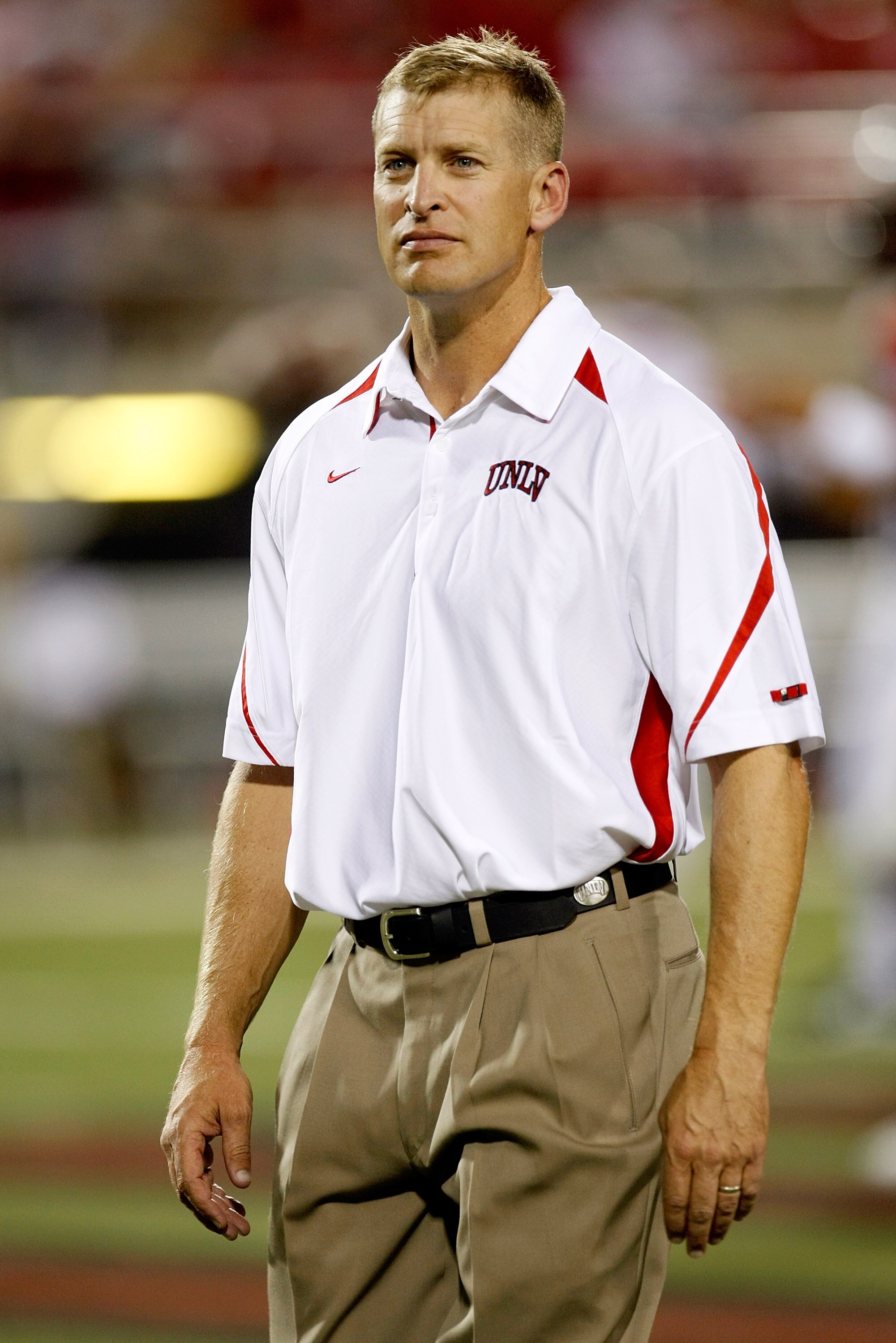LAS VEGAS - SEPTEMBER 04:  UNLV Rebels head coach Bobby Hauck watches his team warm up before their game against the Wisconsin Badgers at Sam Boyd Stadium September 4, 2010 in Las Vegas, Nevada. Wisconsin won 41-21.  (Photo by Ethan Miller/Getty Images)
