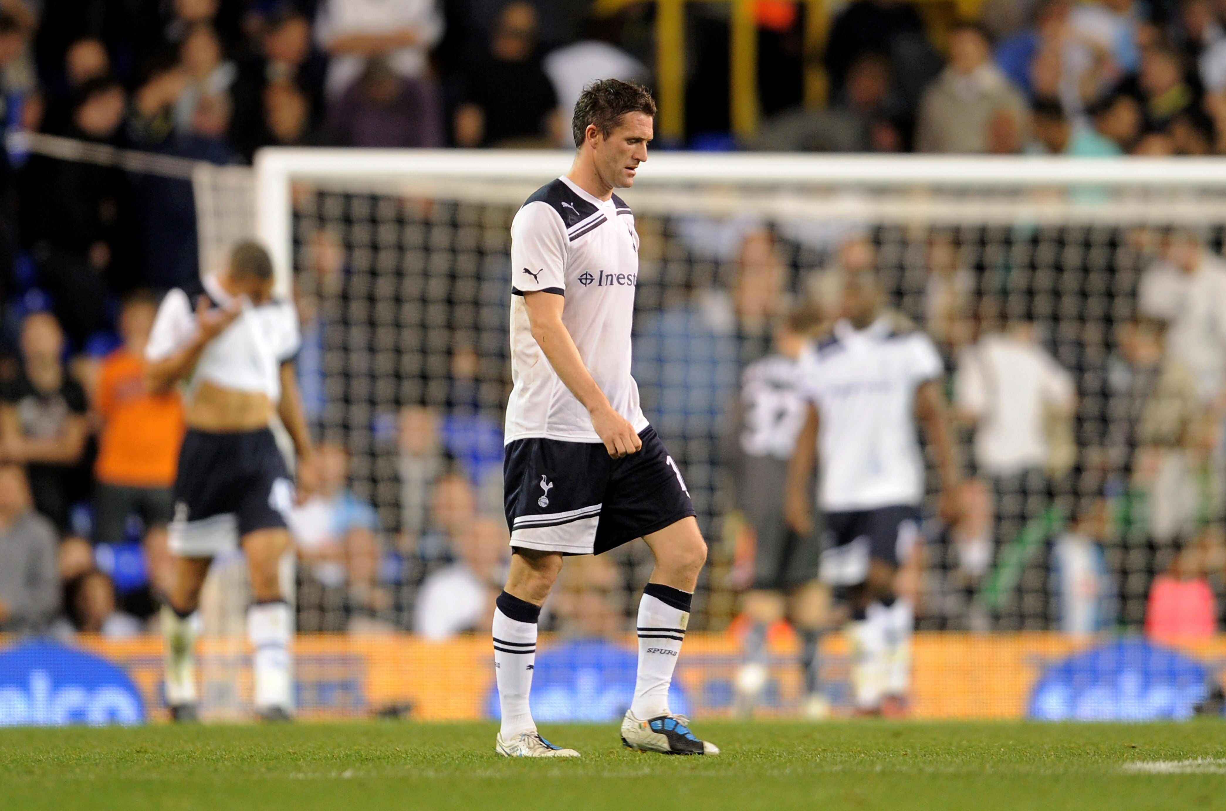 LONDON, ENGLAND - SEPTEMBER 21:  A dejected Robbie Keane and teammates look on after conceding four goals during the Carling Cup third round match between Tottenham Hotspur and Arsenal at White Hart Lane on September 21, 2010 in London, England.  (Photo b