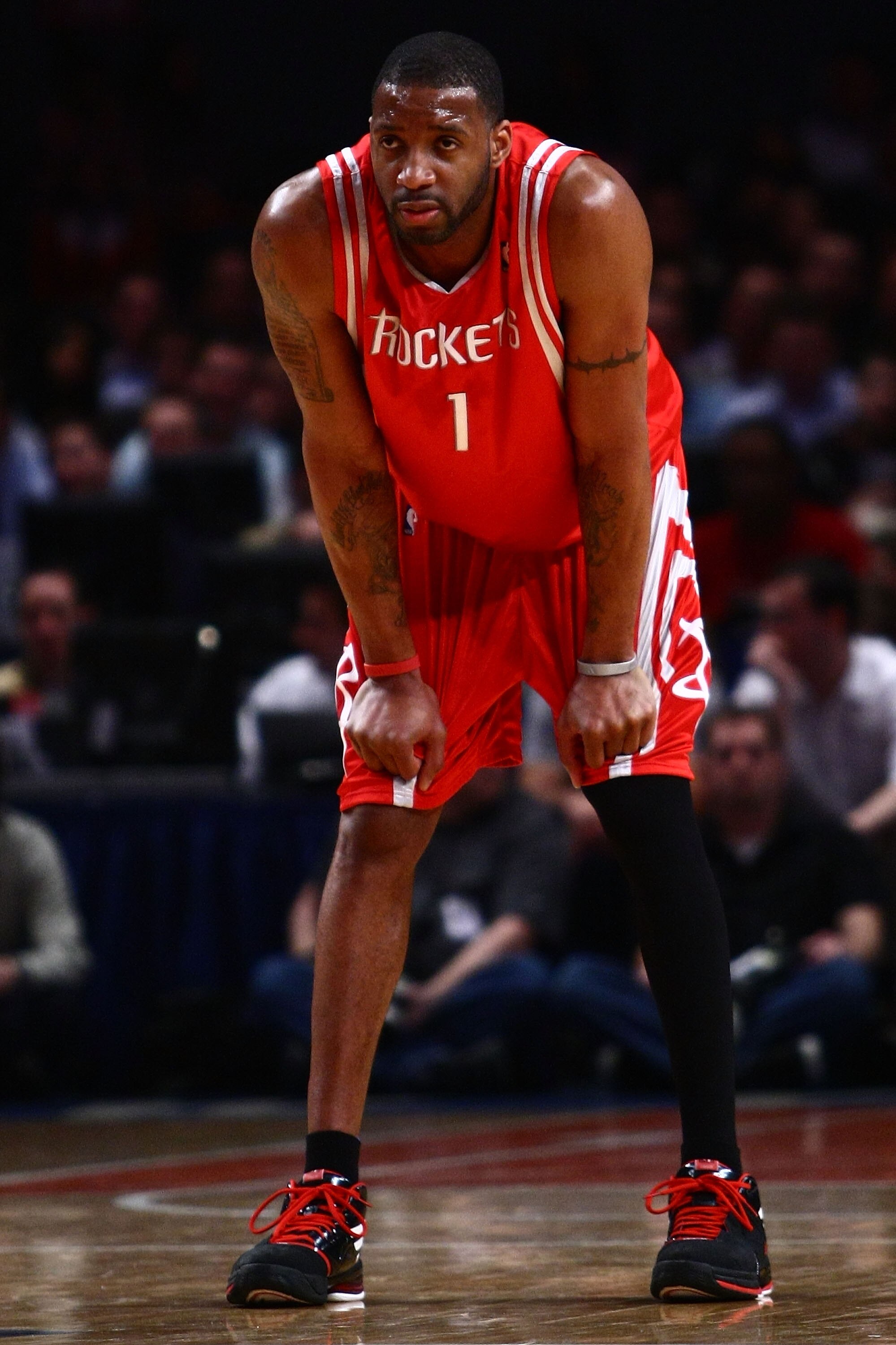 NEW YORK - JANUARY 26: Tracy McGrady #1 of the Houston Rockets watches on against the New York Knicks at Madison Square Garden January 26, 2009 in New York City. NOTE TO USER: User expressly acknowledges and agrees that, by downloading and/or using this NEW YORK - JANUARY 26: Tracy McGrady #1 of the Houston Rockets watches on against the New York Knicks at Madison Square Garden January 26, 2009 in New York City. NOTE TO USER: User expressly acknowledges and agrees that, by downloading and/or using this