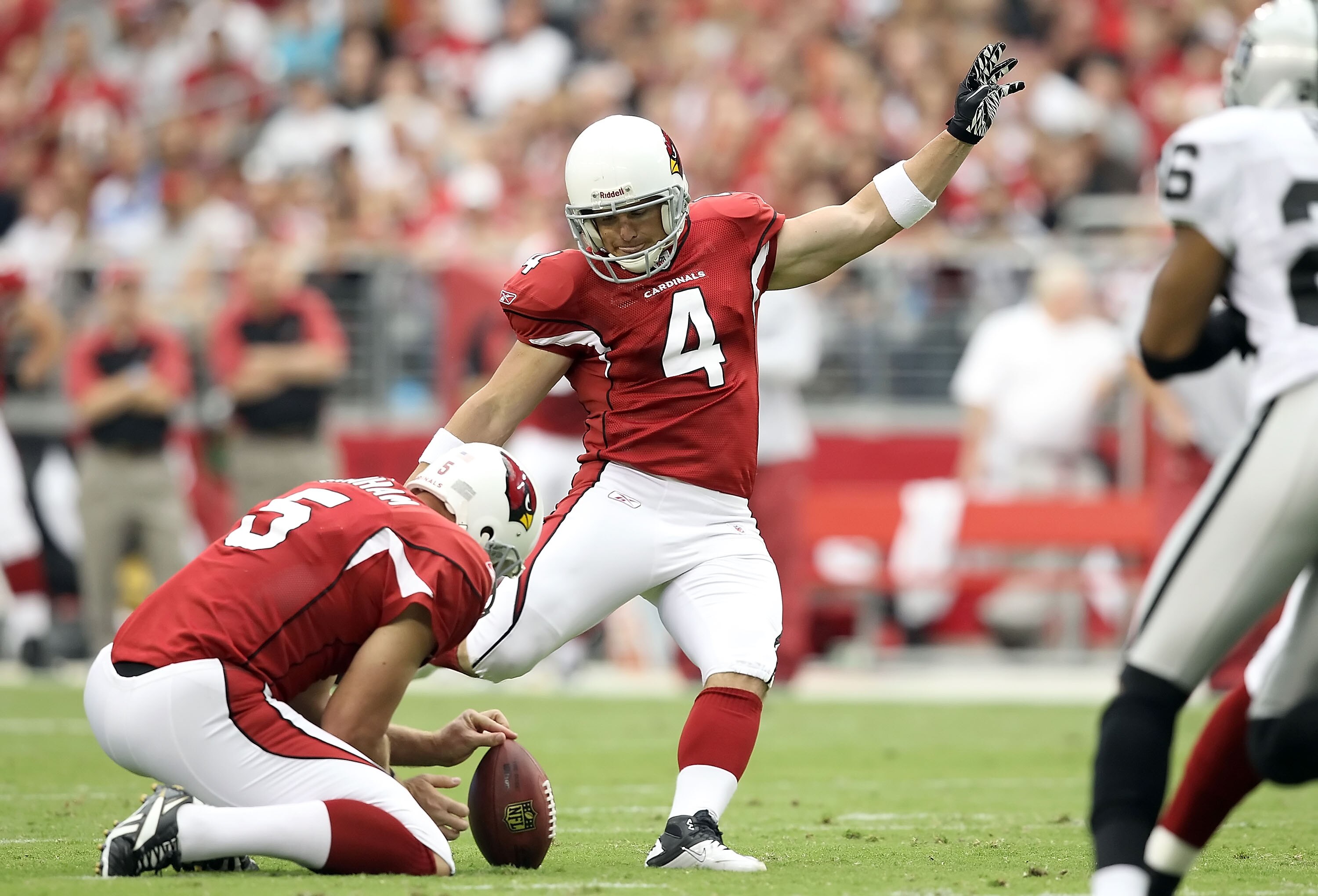 GLENDALE, AZ - SEPTEMBER 26:  Kicker Jay Feely #4 of the Arizona Cardinals kicks a 42 yard field goal against the Oakland Raiders during the first quarter of the NFL game at the University of Phoenix Stadium on September 26, 2010 in Glendale, Arizona.  (P