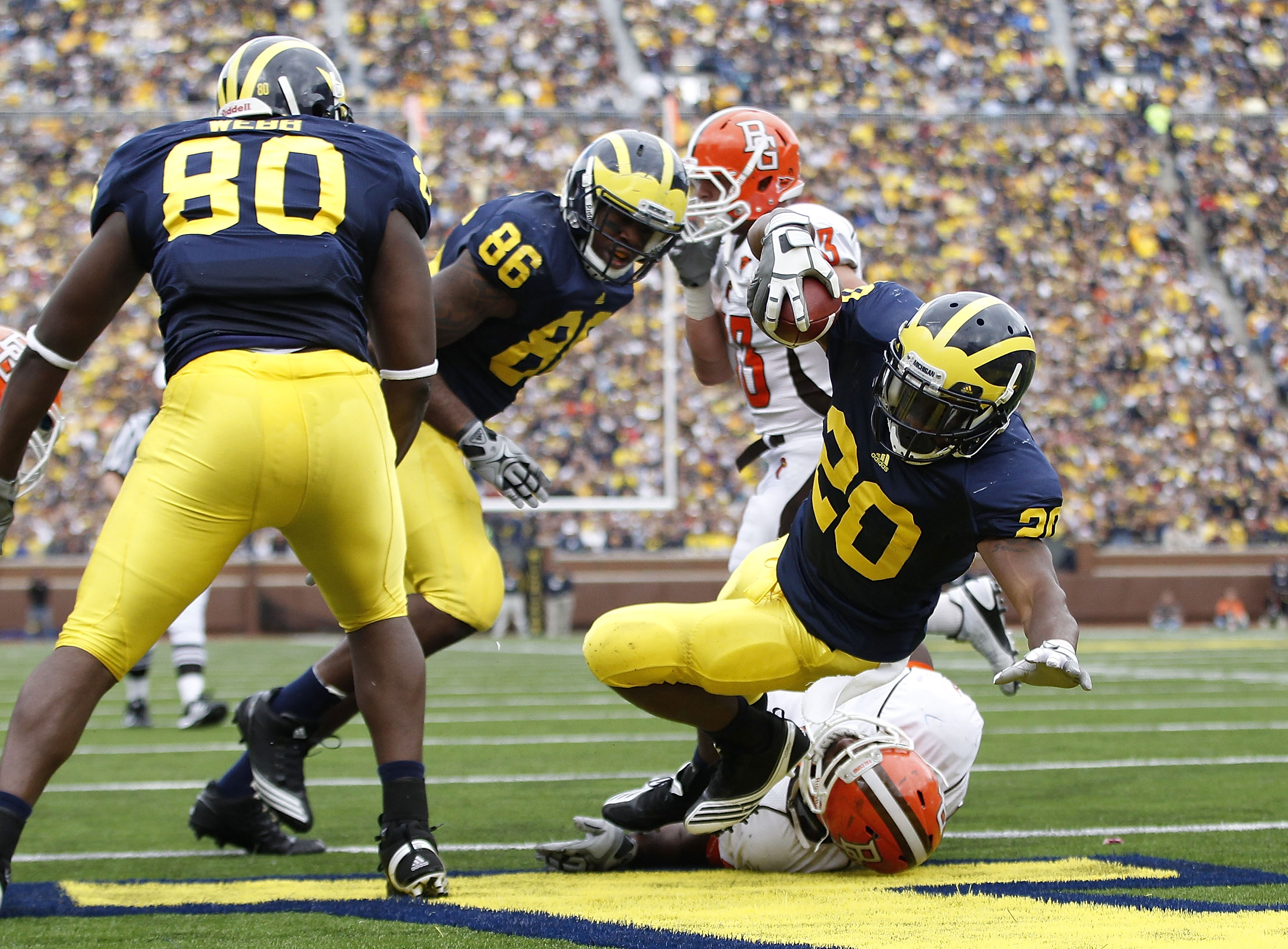 ANN ARBOR, MI - SEPTEMBER 25:  Michael Shaw #20 of the Michigan Wolverines runs for a second quarter touchdown during the game against Bowling Green on September 25, 2010 at Michigan Stadium in Ann Arbor, Michigan.  (Photo by Leon Halip/Getty Images)