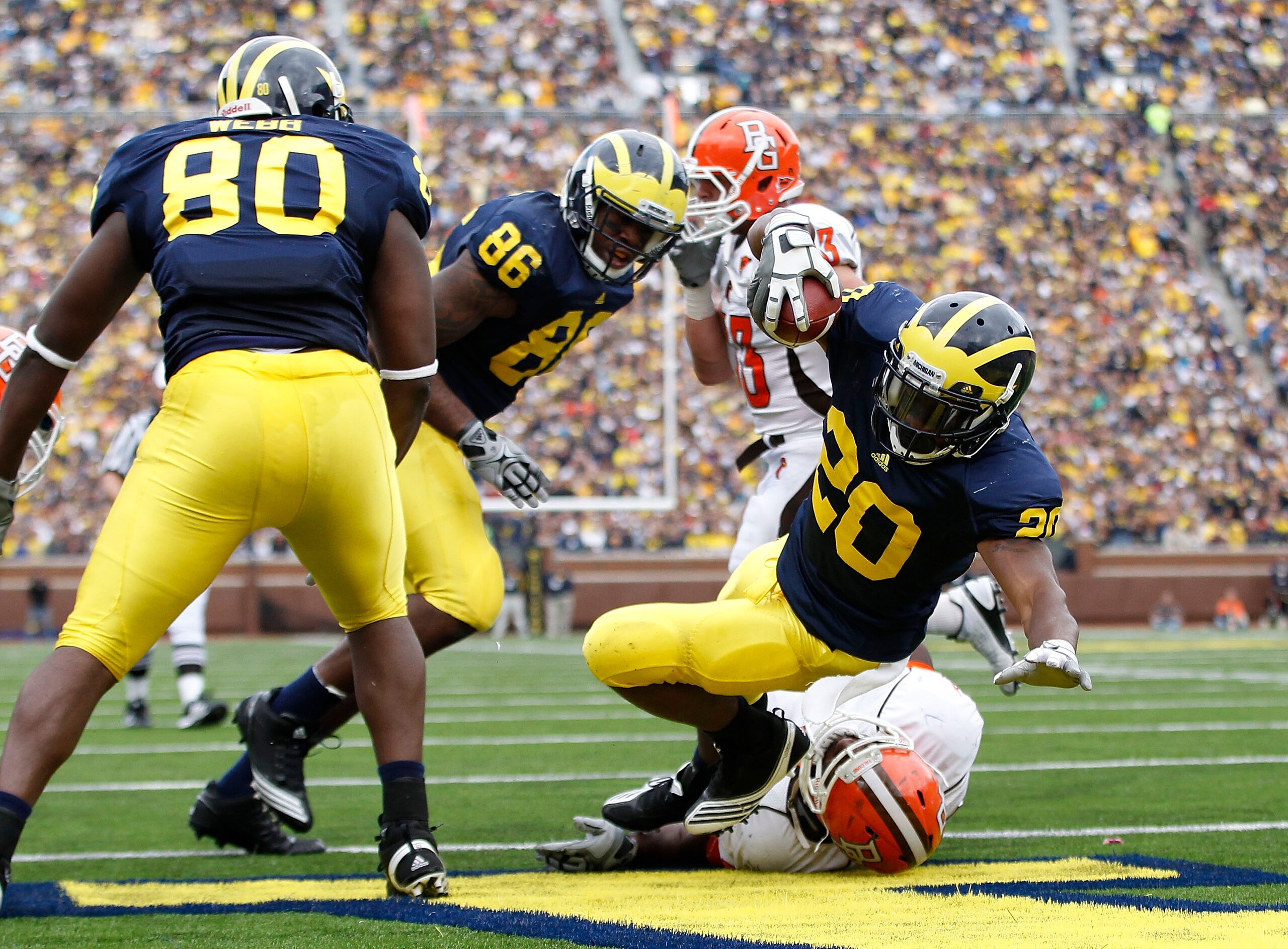 ANN ARBOR, MI - SEPTEMBER 25:  Michael Shaw #20 of the Michigan Wolverines runs for a second quarter touchdown during the game against Bowling Green on September 25, 2010 at Michigan Stadium in Ann Arbor, Michigan.  (Photo by Leon Halip/Getty Images)