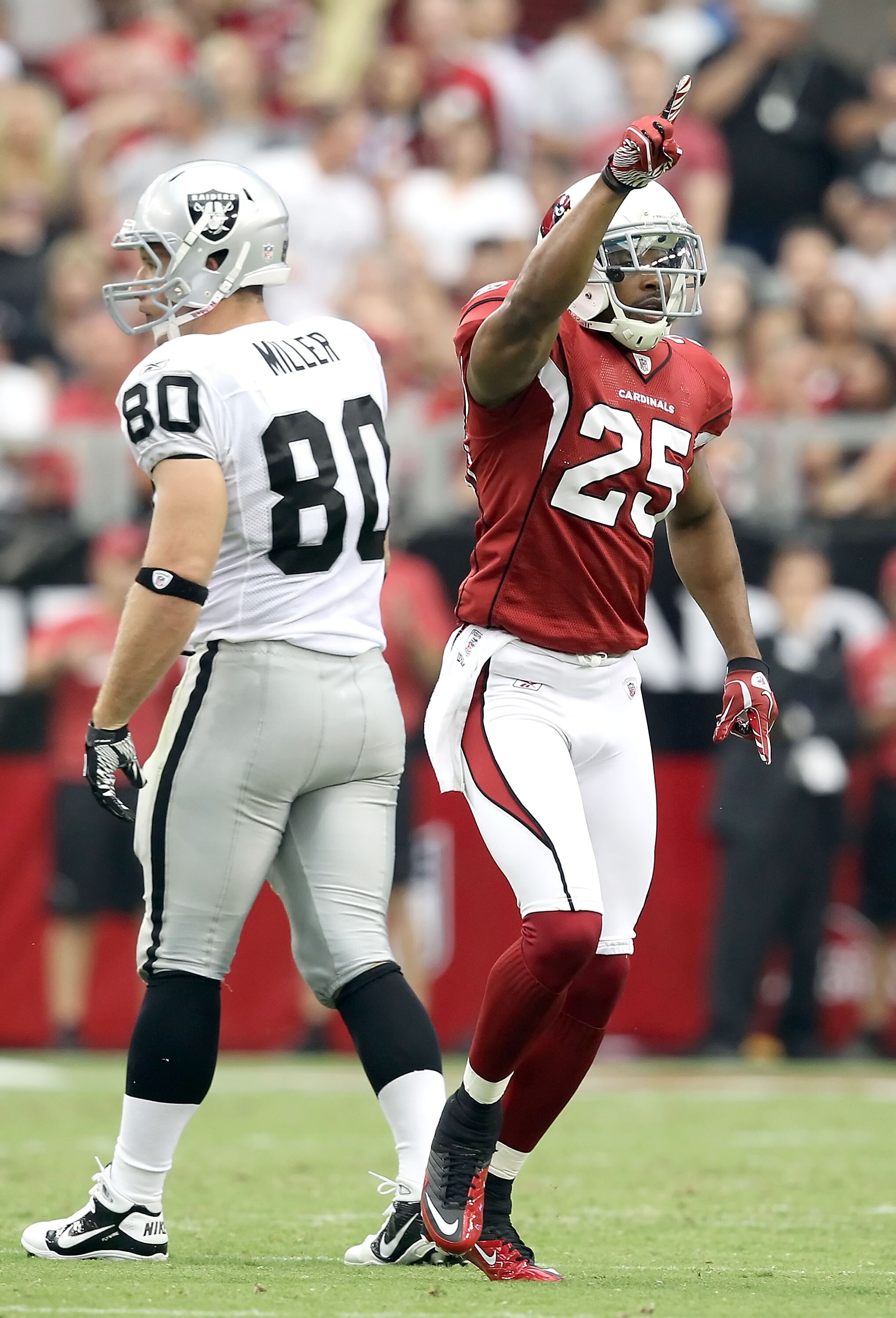 GLENDALE, AZ - SEPTEMBER 26:  Safety Kerry Rhodes #25 of the Arizona Cardinals celebrates after making a defensive stop against the Oakland Raiders during the second quarter of the NFL game at the University of Phoenix Stadium on September 26, 2010 in Gle