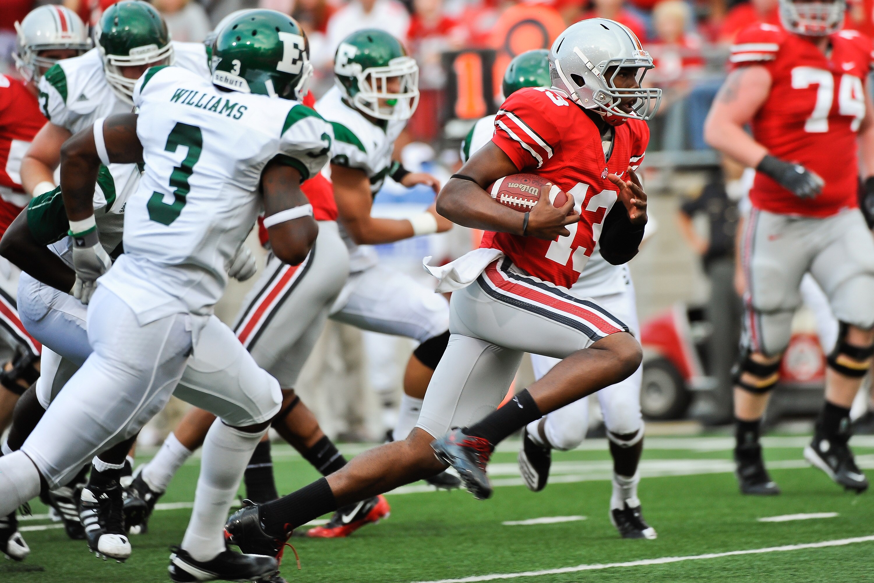 COLUMBUS, OH - SEPTEMBER 25:  Ken Guiton #13 of the Ohio State Buckeyes runs with the ball against the Eastern Michigan Eagles at Ohio Stadium on September 25, 2010 in Columbus, Ohio.  Ohio State won 73-20. (Photo by Jamie Sabau/Getty Images)