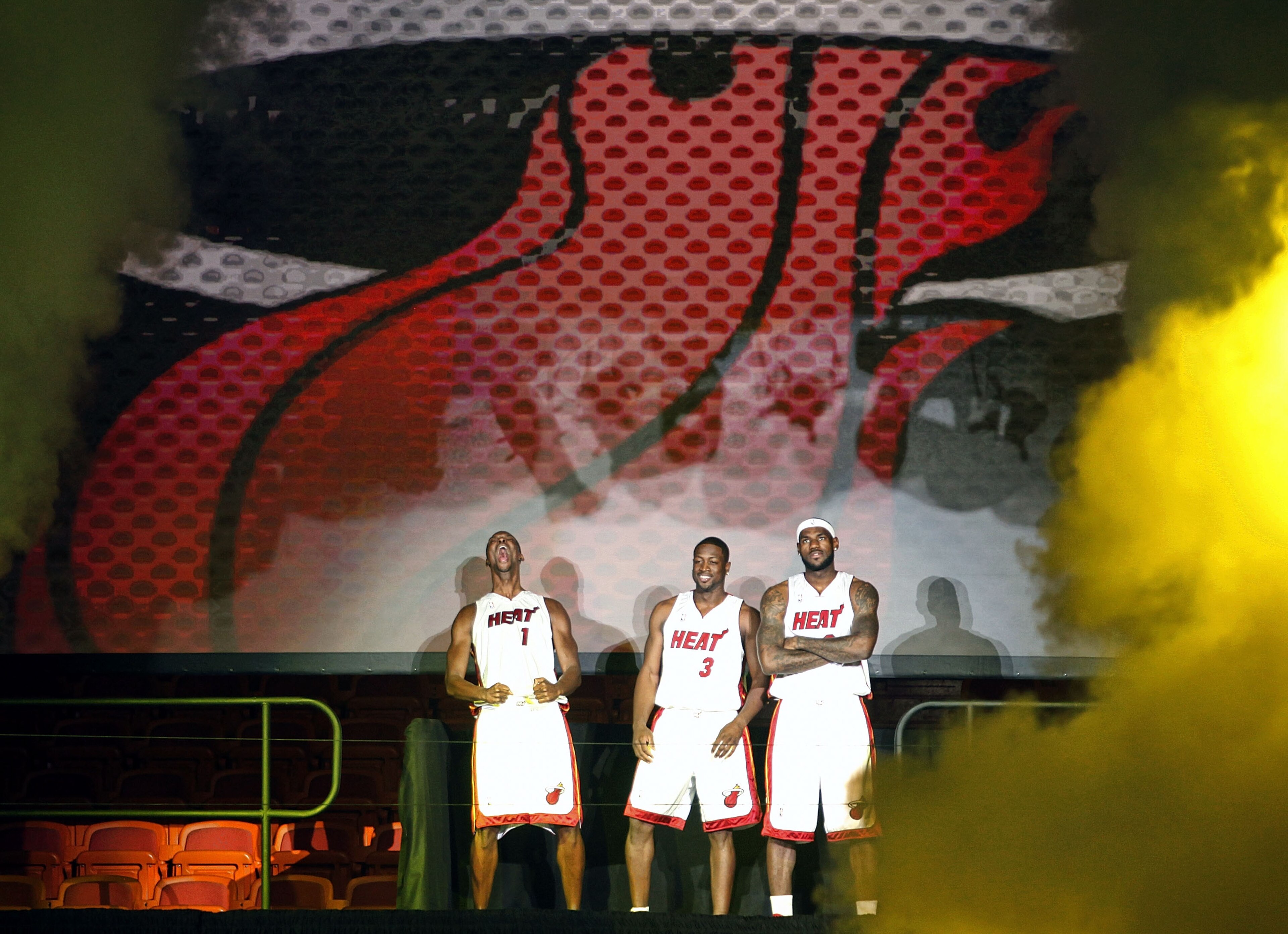 MIAMI - JULY 09: Fans cheer as (L-R) Chris Bosh #1, Dwyane Wade #3, and LeBron James #6 of the Miami Heat are introduced during a welcome party at American Airlines Arena on July 9, 2010 in Miami, Florida. (Photo by Marc Serota/Getty Images) MIAMI - JULY 09: Fans cheer as (L-R) Chris Bosh #1, Dwyane Wade #3, and LeBron James #6 of the Miami Heat are introduced during a welcome party at American Airlines Arena on July 9, 2010 in Miami, Florida. (Photo by Marc Serota/Getty Images)