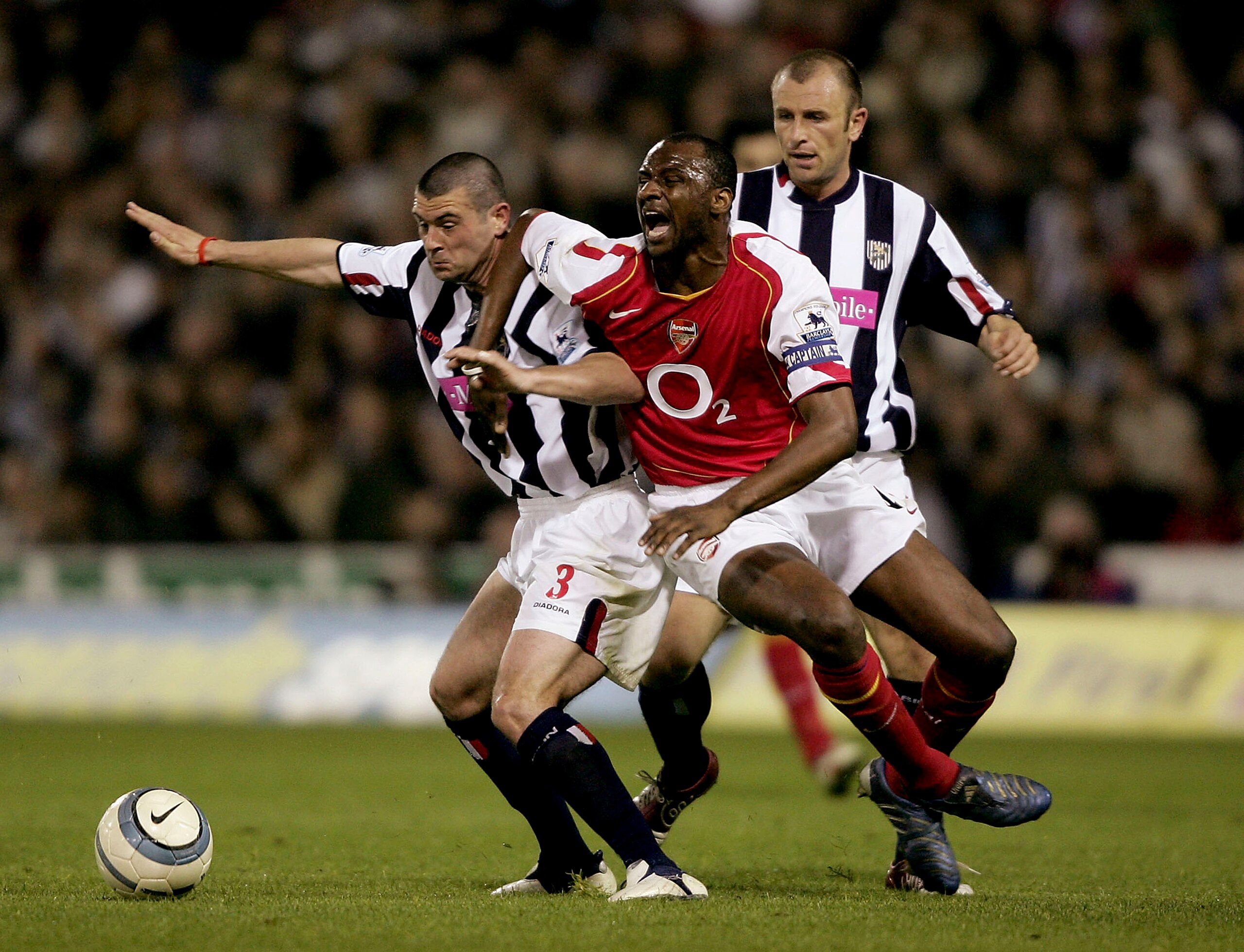 WEST BROMWICH, ENGLAND - MAY 2: Patrick Vieira of Arsenal tangles with Neil Clement of West Brom during the Barclays Premiership game between West Bromwich Albion and Arsenal at The Hawthorns on May 2, 2005 in Birmingham, England.  (Photo by Stu Forster/G