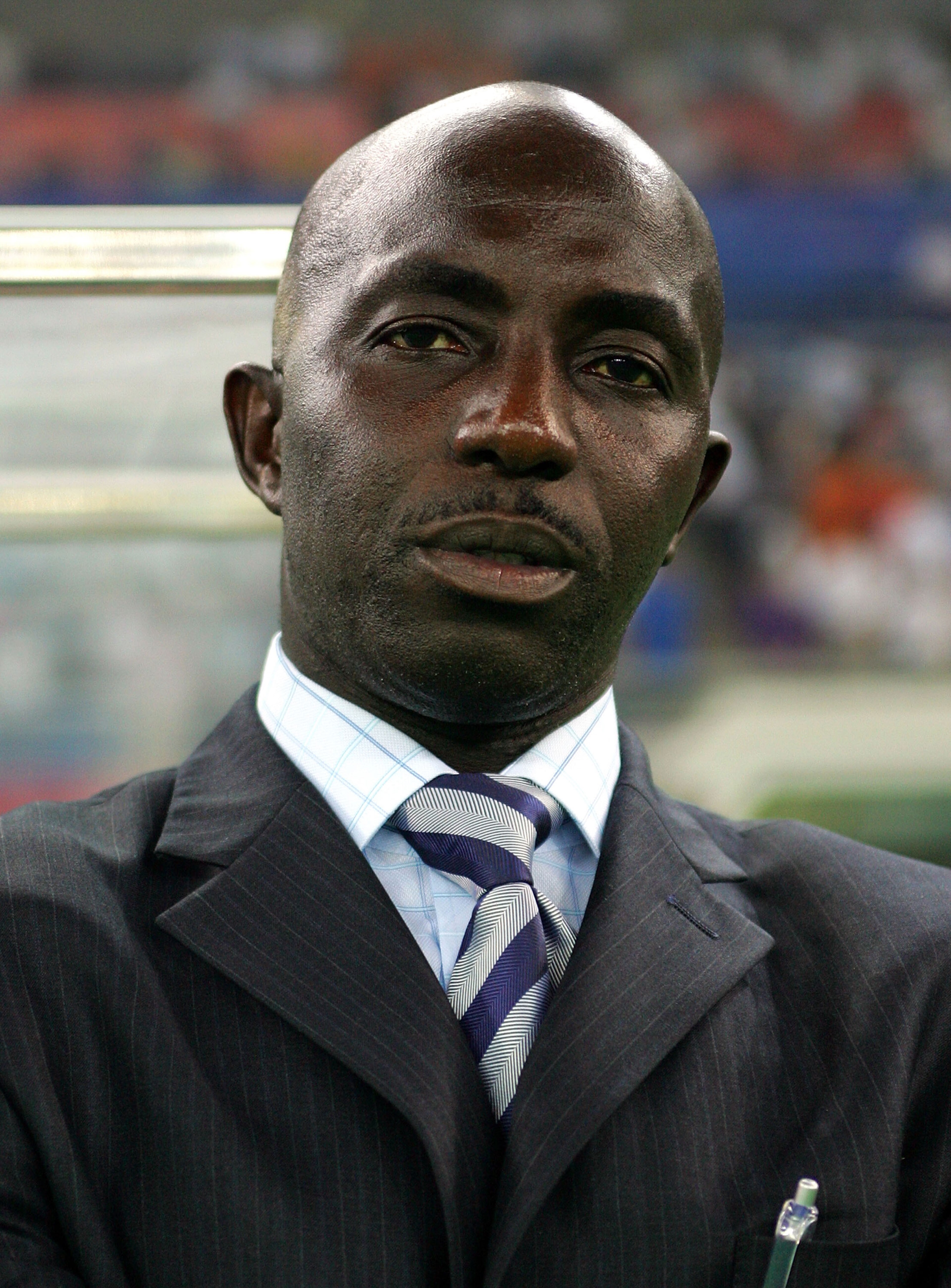 TIANJIN, CHINA - AUGUST 07:  Nigeria coach Samson Siasia looks on during Men's Group B match between Netherlands and Nigeria  on Day -1 of the Beijing 2008 Olympic Games on August 7, 2008 in Tianjin, China.  (Photo by Koji Watanabe/Getty Images)