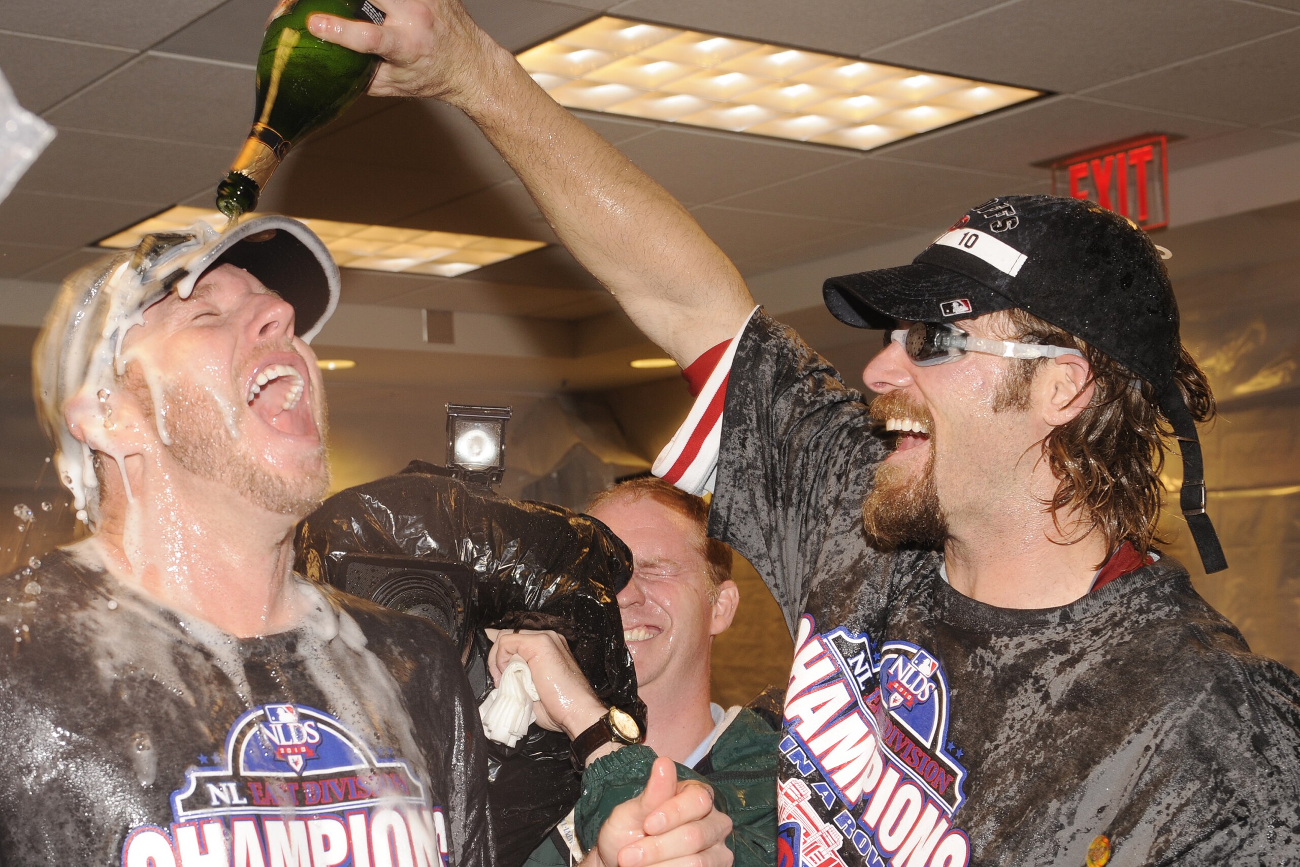 WASHINGTON - SEPTEMBER 27:  Roy Halliday and Jayson Werth of the Philadelphia Phillies celebrate clinching the National League East Title after a baseball game against the Washington Nationals on September 27, 2010 at Nationals Park in Washington, D.C.  T