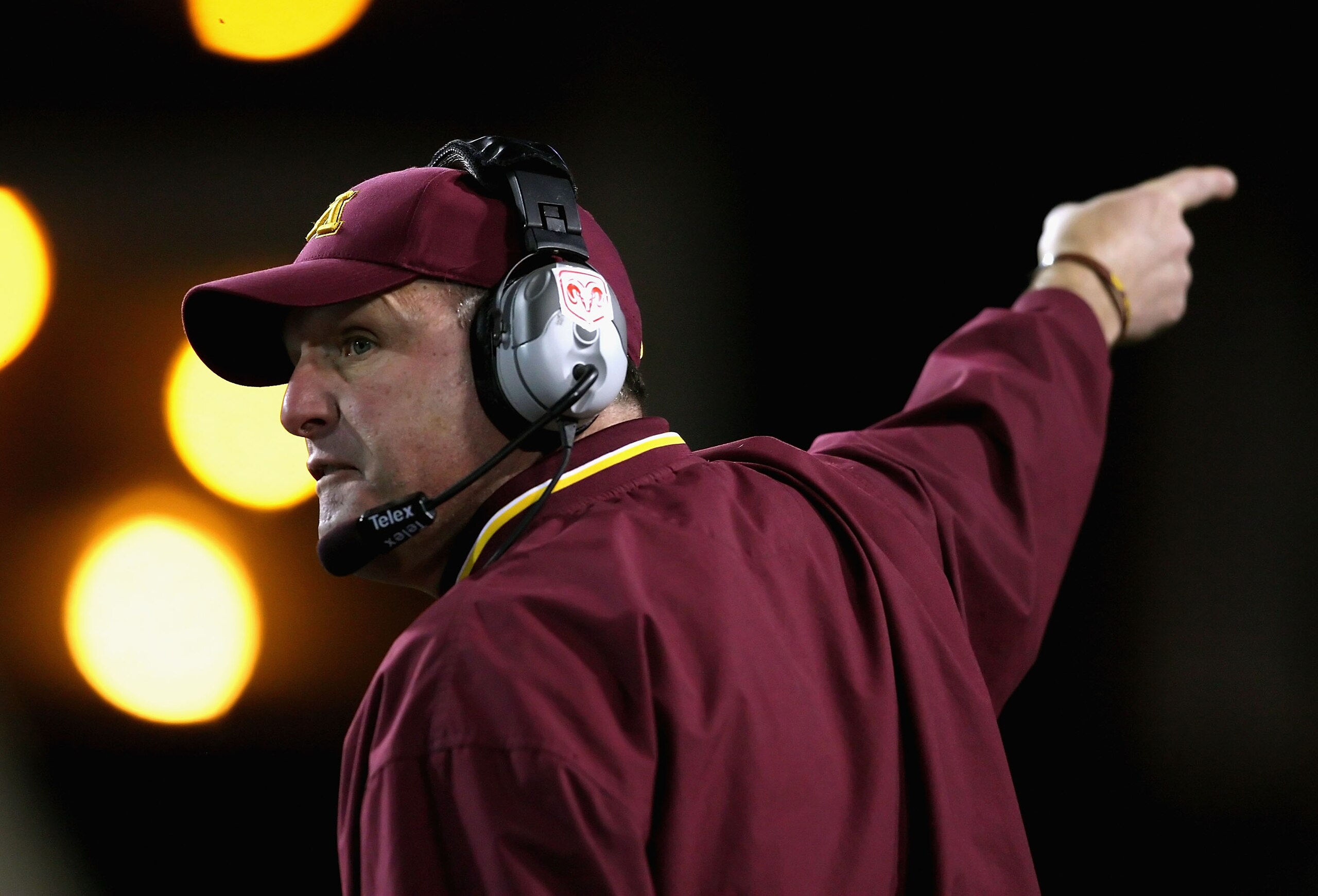 TEMPE, AZ - DECEMBER 31:  Head coach Tim Brewster of the Minnesota Golden Gophers signals for a first down during the Insight Bowl against the Iowa State Cyclones at Arizona Stadium on December 31, 2009 in Tempe, Arizona. The Cyclones defeated the Golden