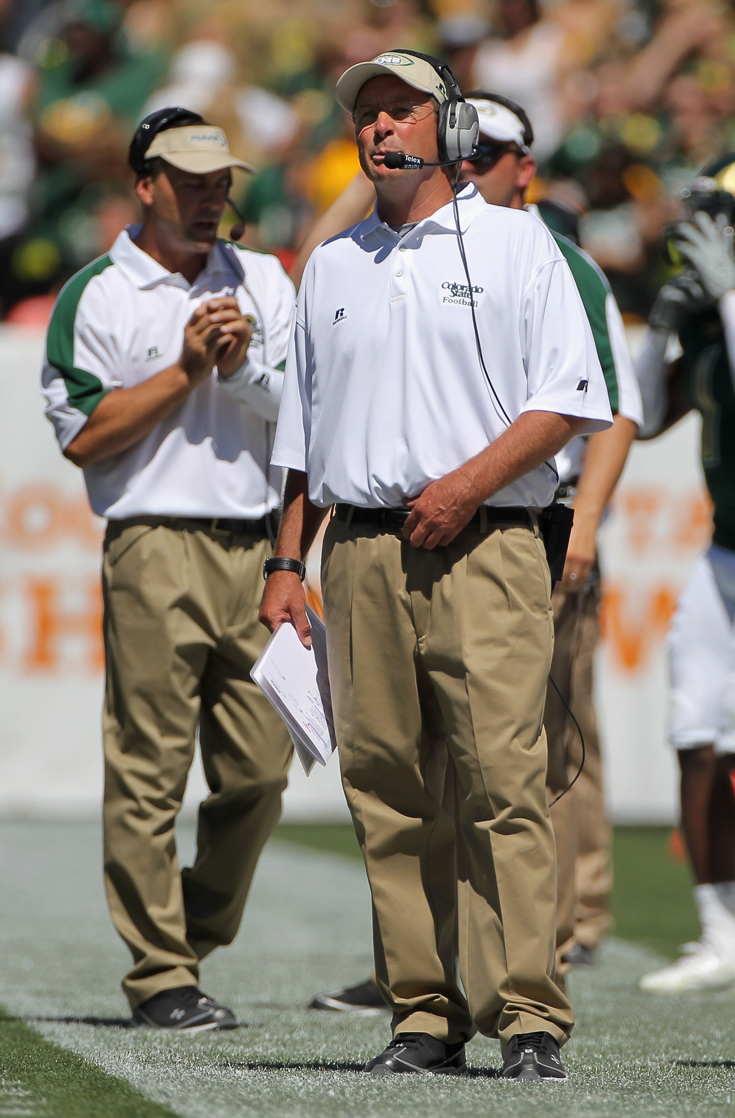 DENVER - SEPTEMBER 04:  Head coach Steve Fairchild of the Colorado State Rams leads his team against the Colorado Buffaloes in the Rocky Mountain Showdown at INVESCO Field at Mile High on September 4, 2010 in Denver, Colorado. Colorado was awarded the Cen